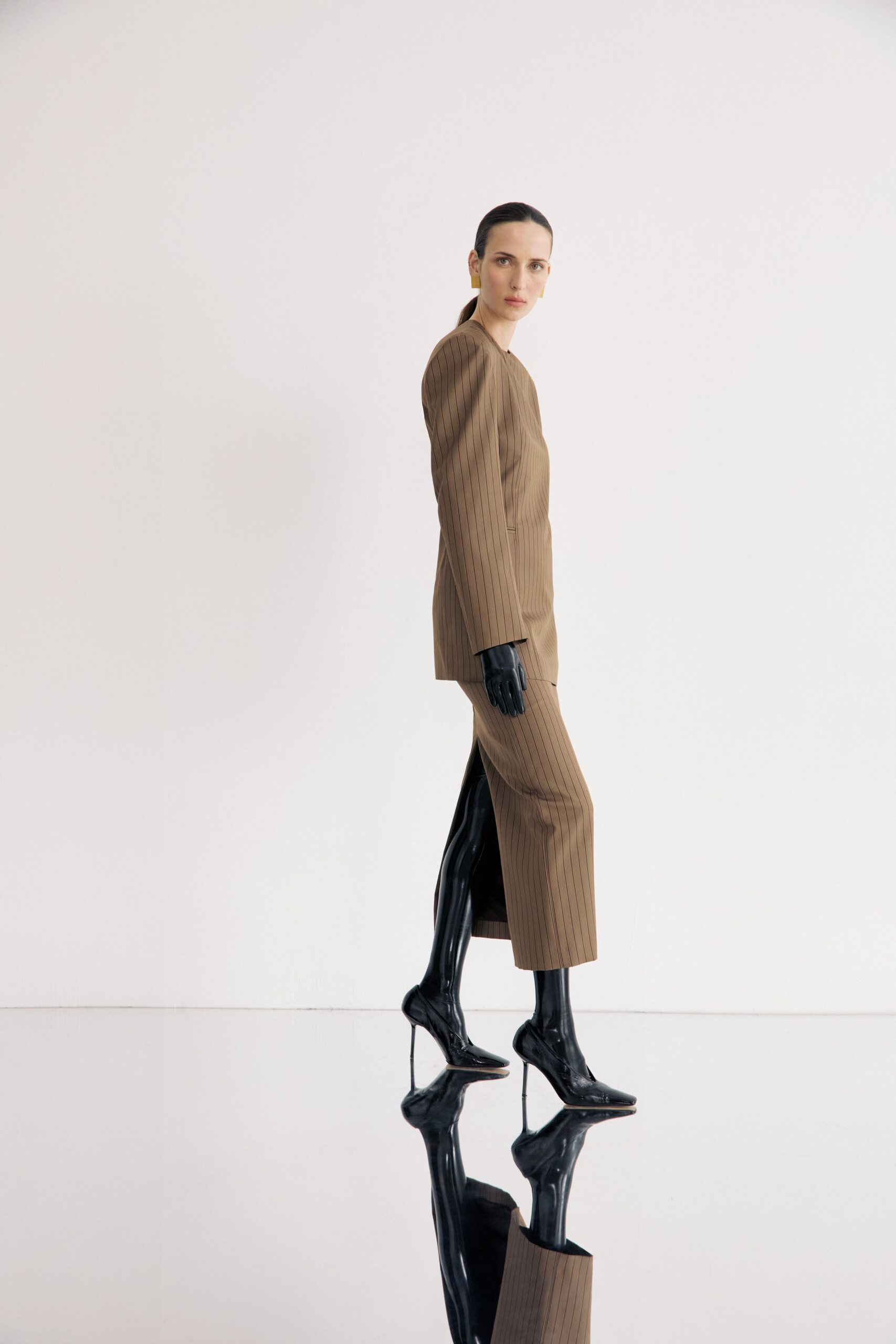 brown tailored suit with black shoes