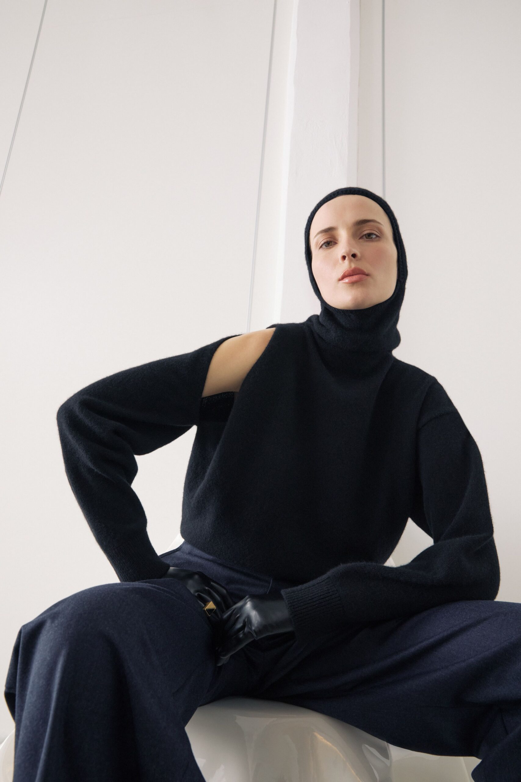 black wool sweater and navy pants