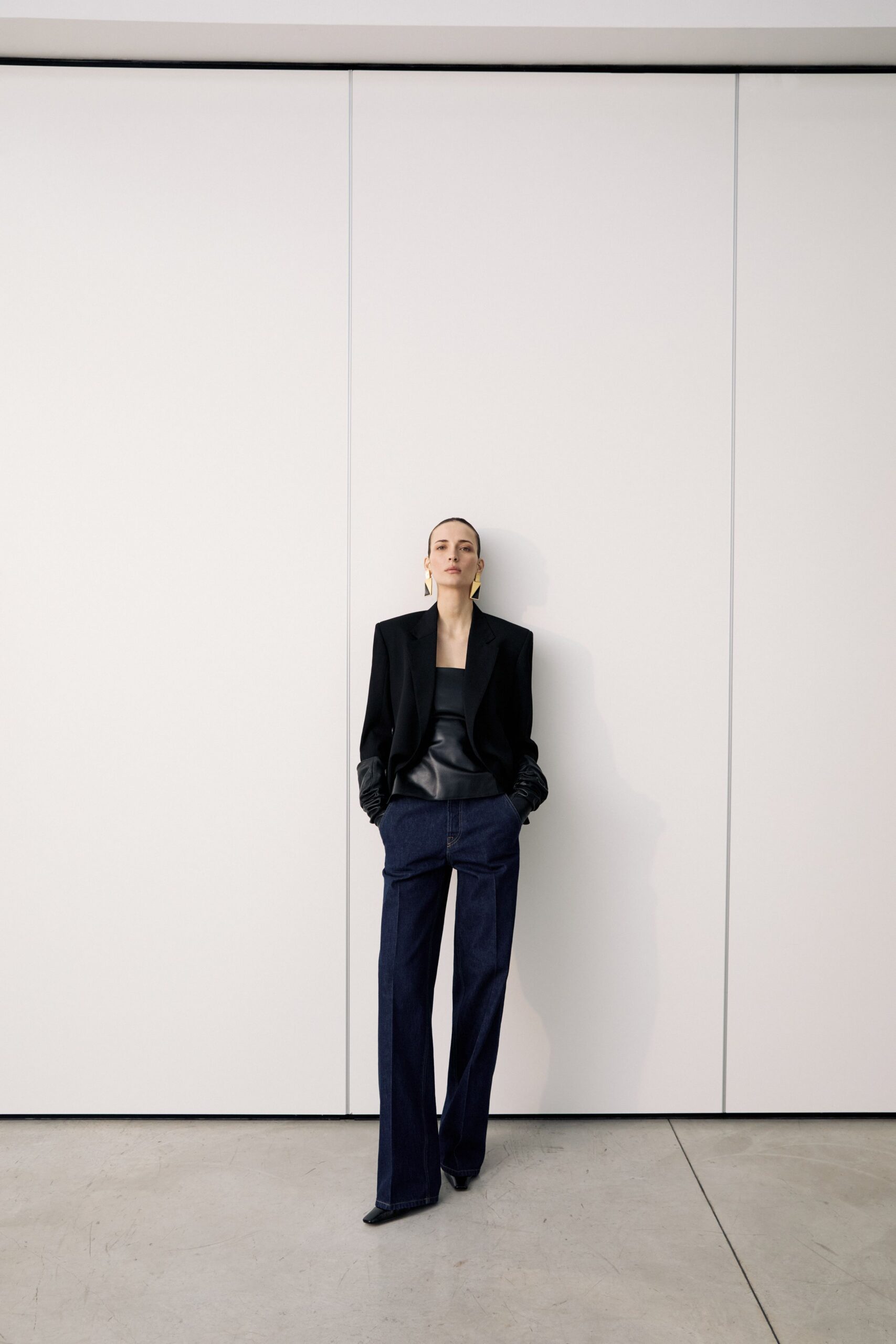 black blazer gray top blue pants
