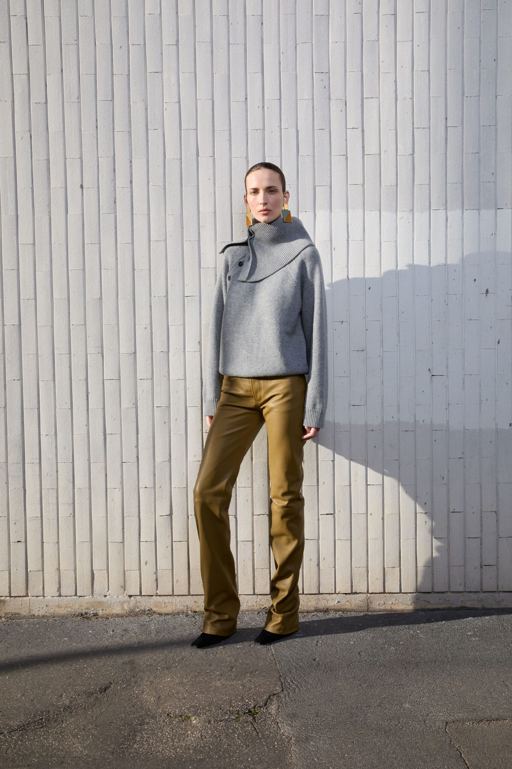 gray relaxed top with gold pants