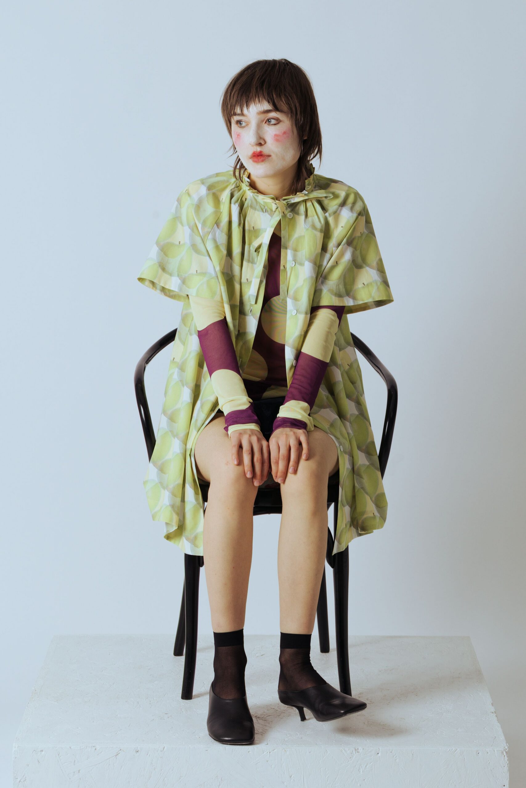 green printed cape with purple top