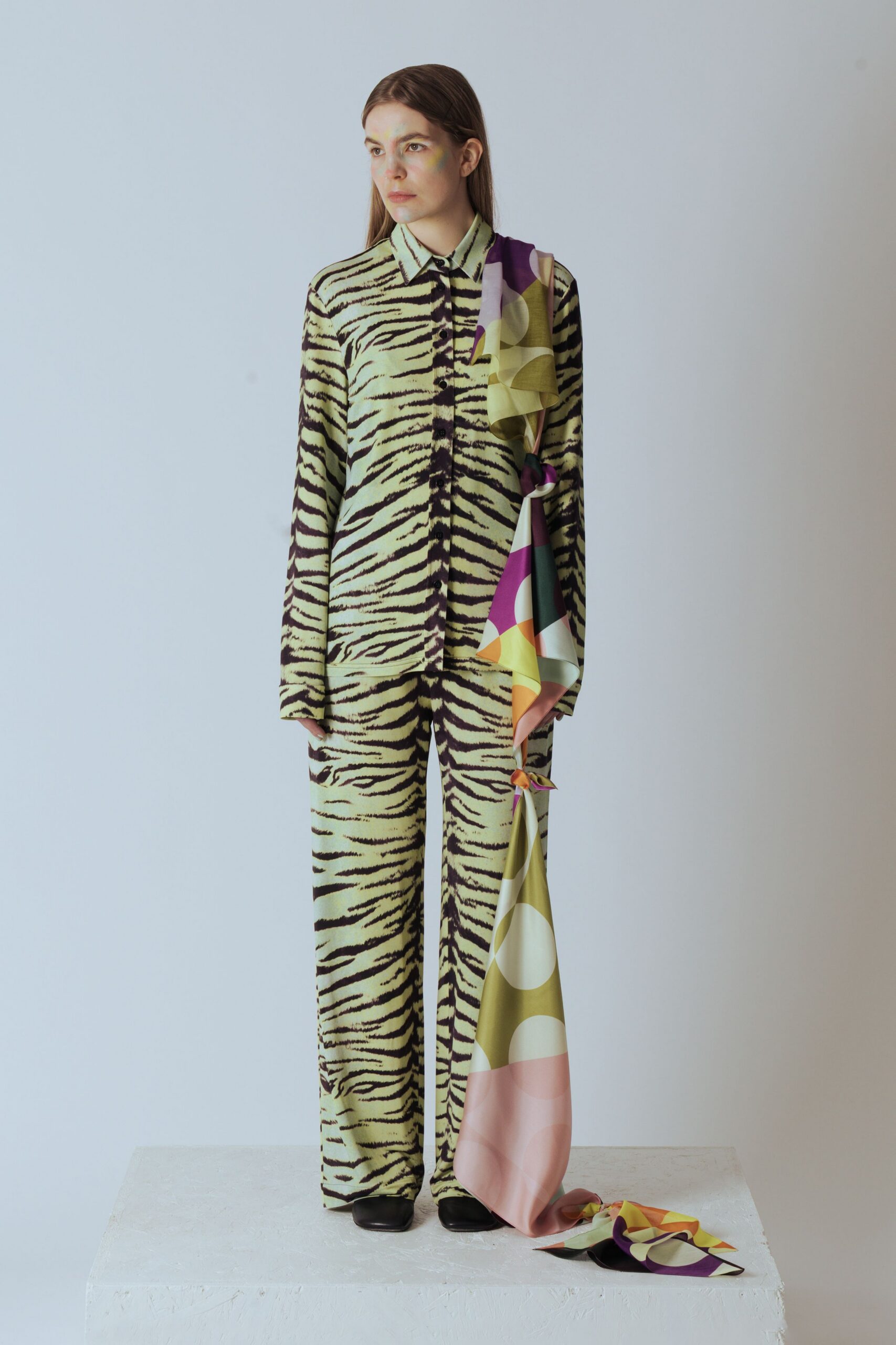 green animal-print shirt and pants