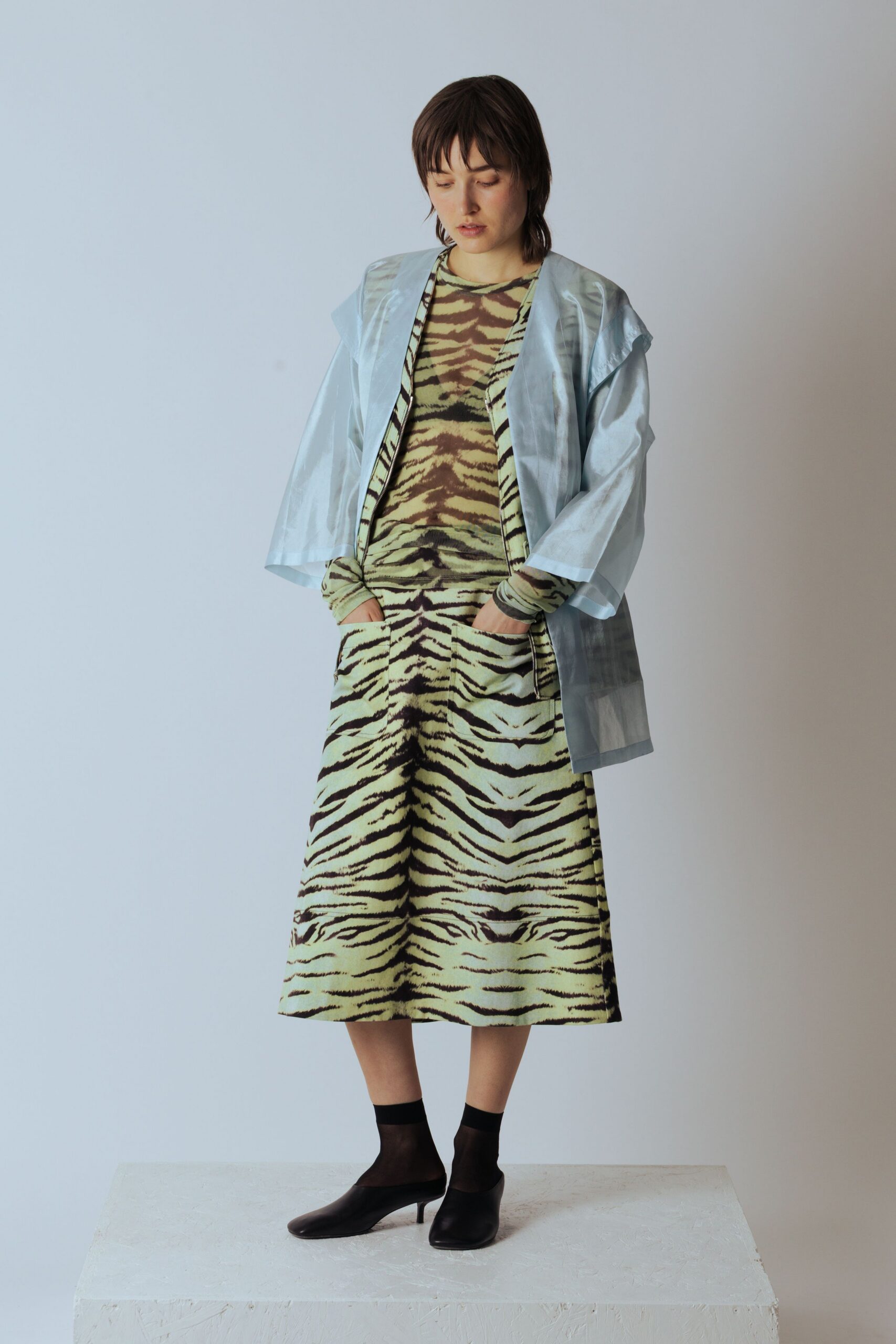 green printed midi dress with light blue jacket