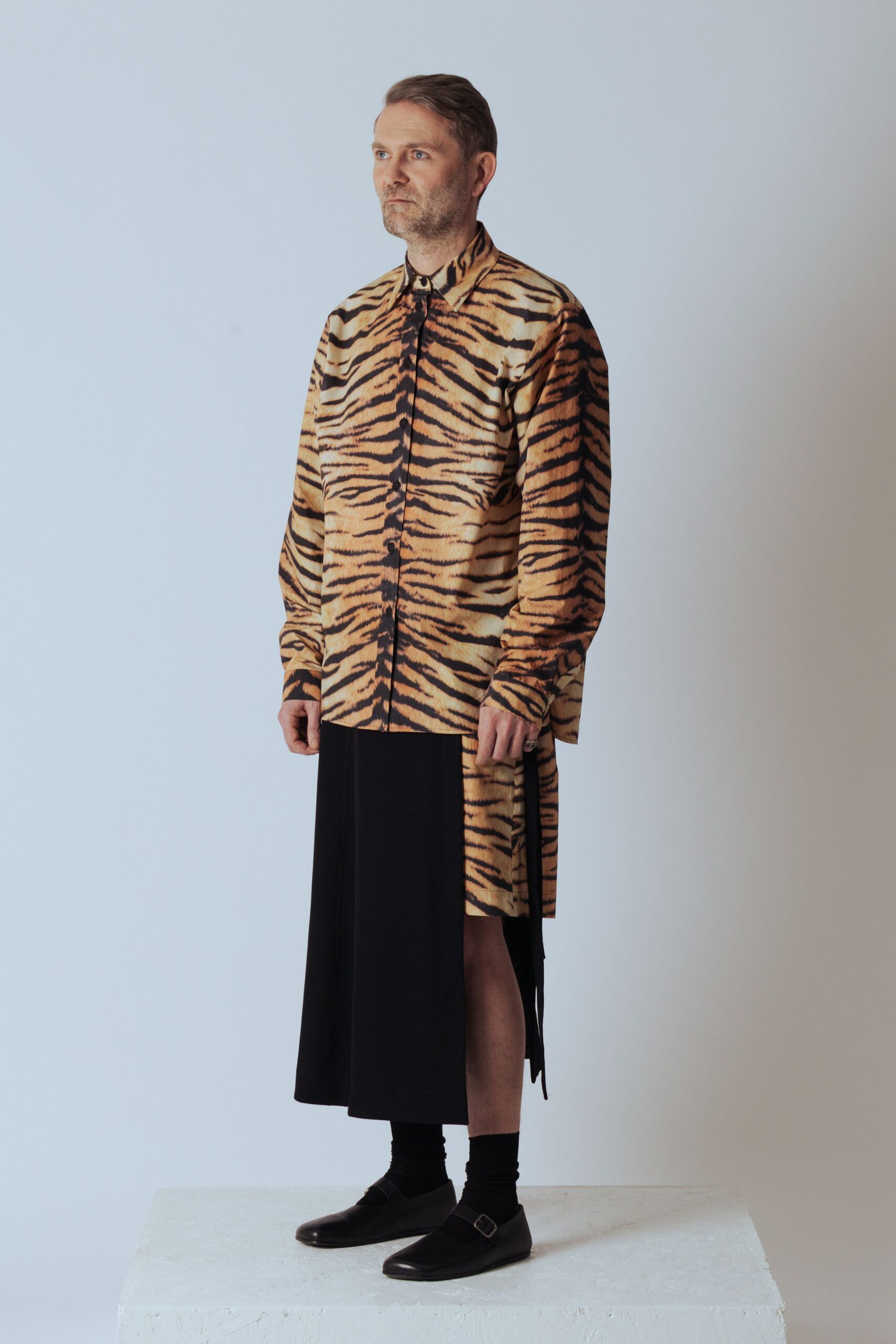 printed shirt with black skirt