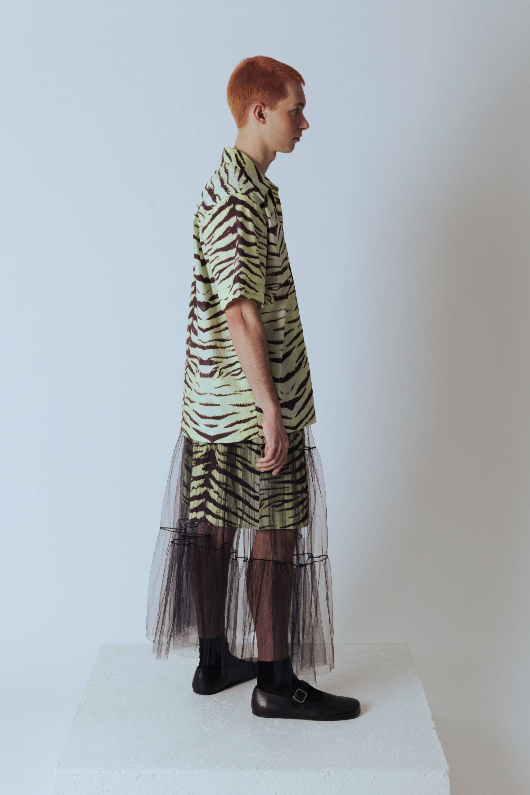 green animal-print shirt with black tulle skirt