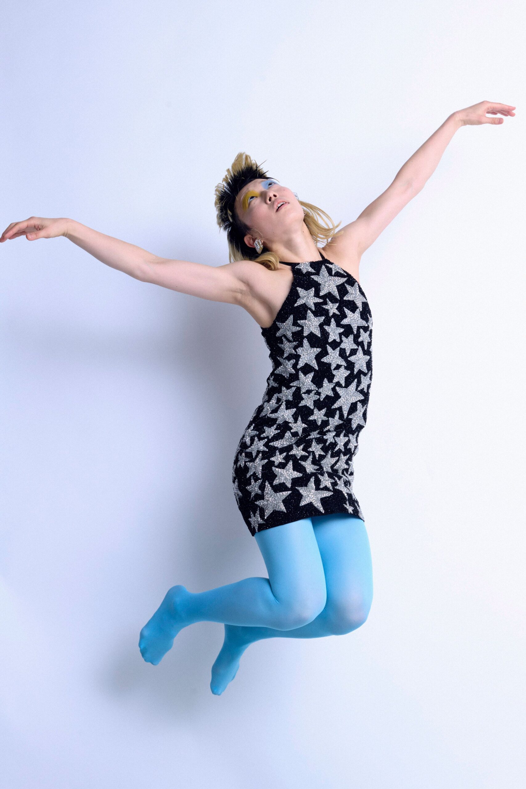 black cotton sleeveless high-neck fitted printed mini dress