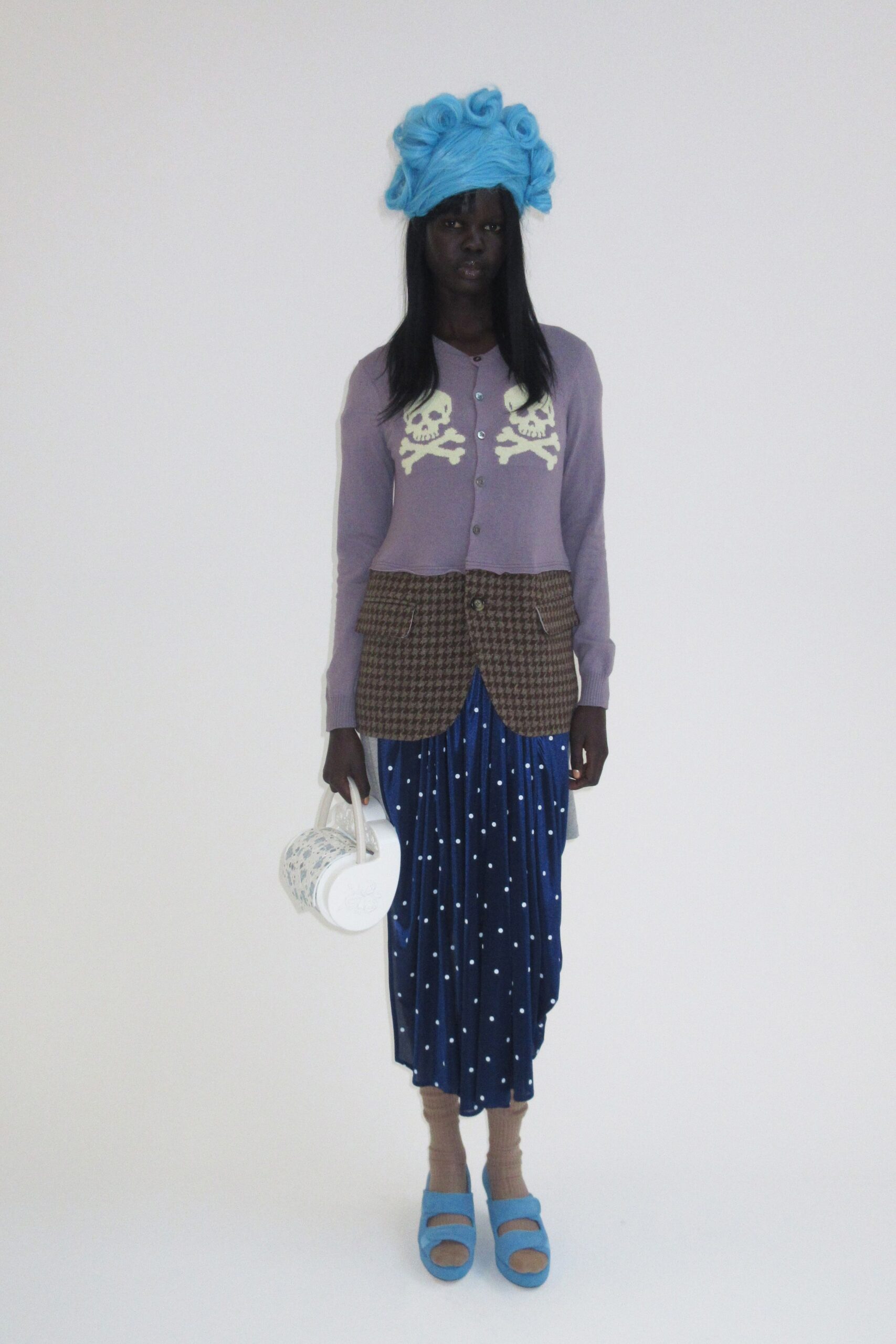 purple cardigan brown vest blue skirt