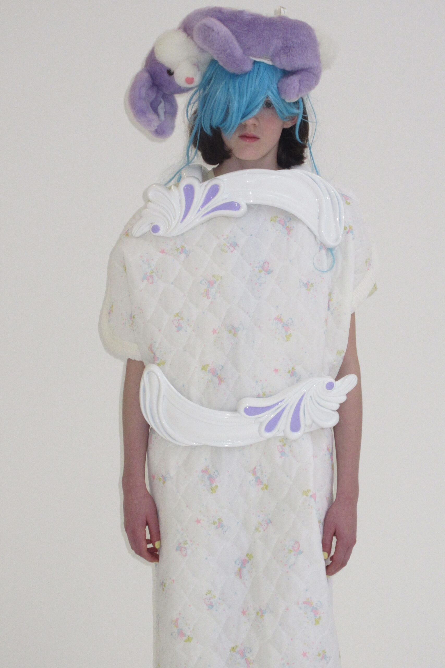 relaxed white quilted dress with purple hat
