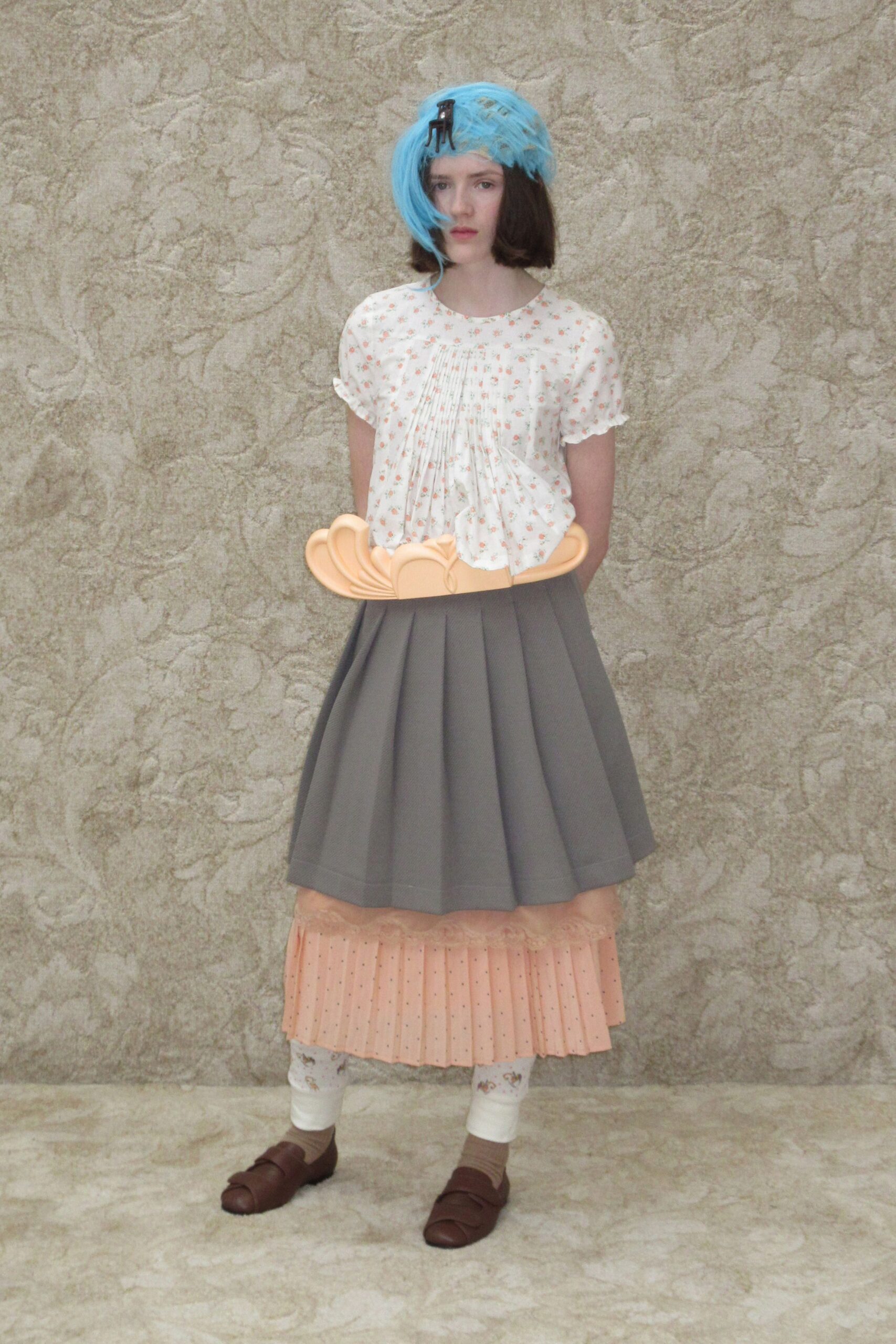 relaxed white pleated top with gray skirt