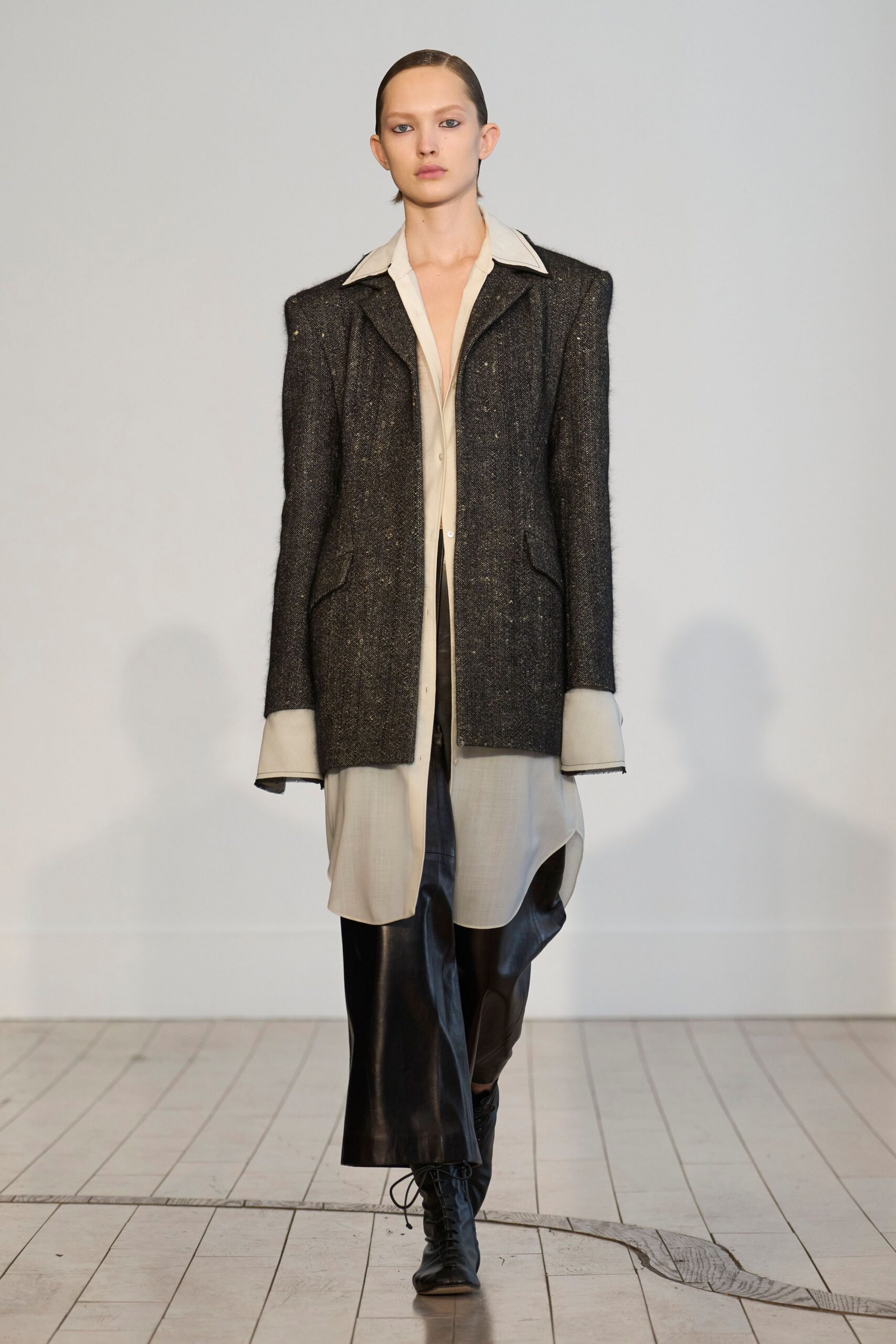 black wool long-sleeve collared structured buttoned jacket