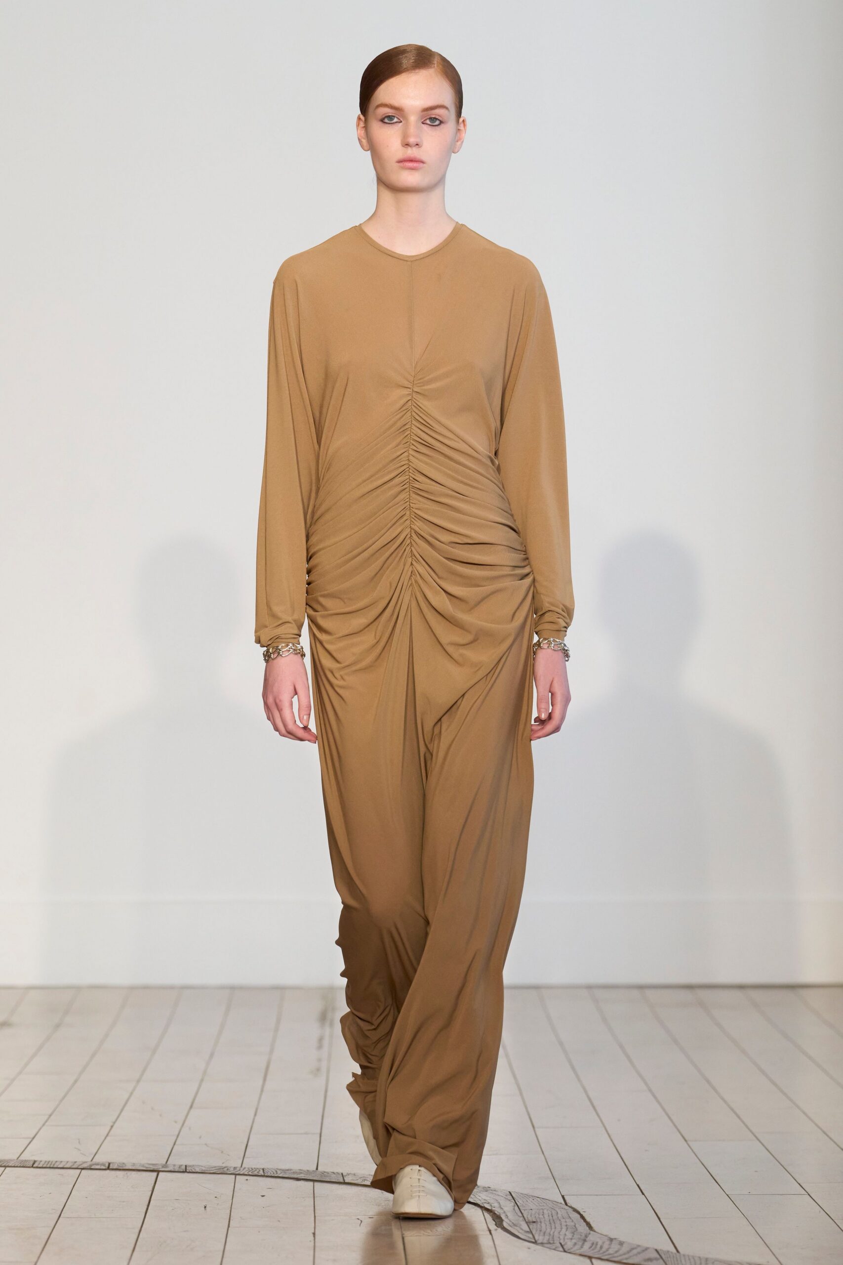 beige silk ruched maxi dress with white shoes
