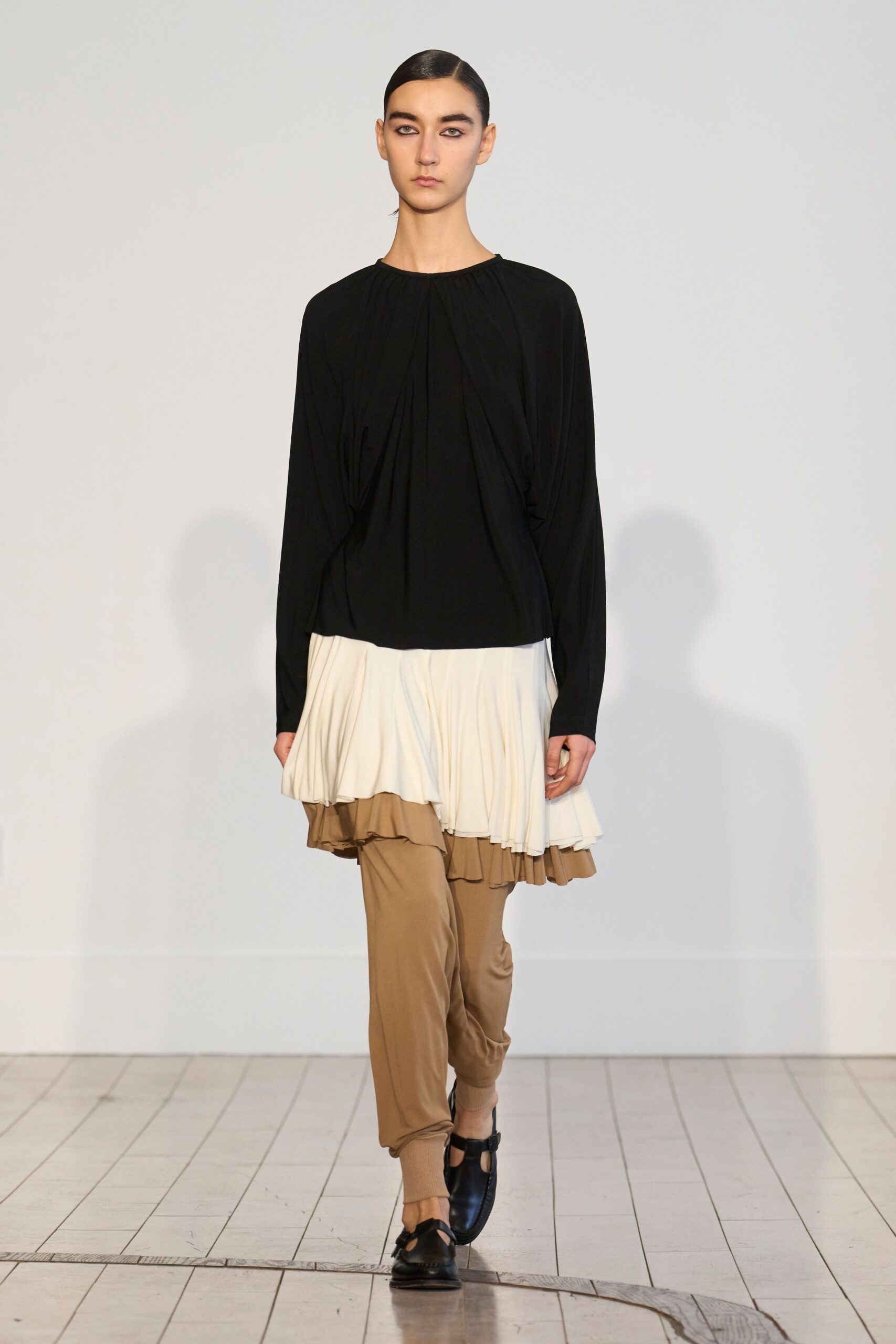 black cotton long-sleeve collared relaxed pleated top