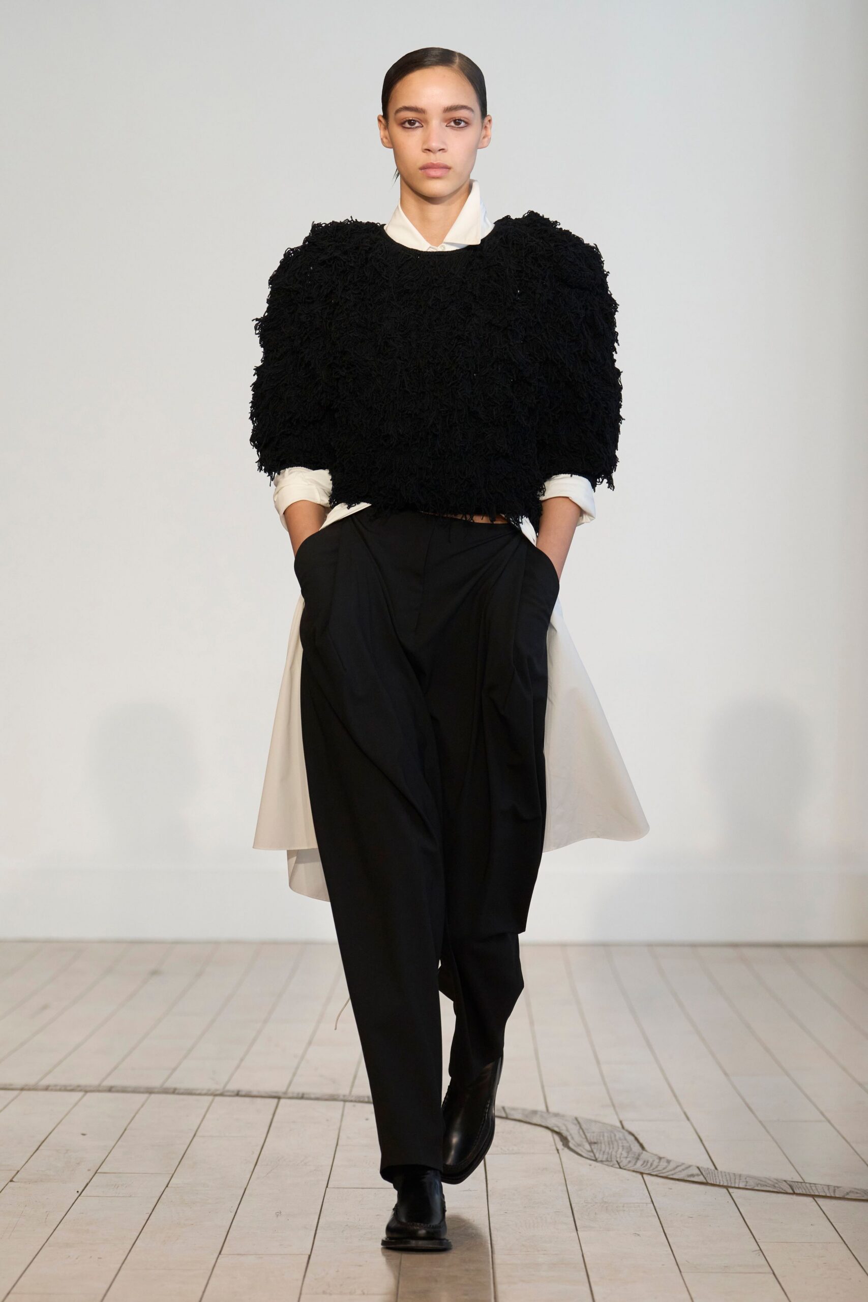 black relaxed top and tailored pants