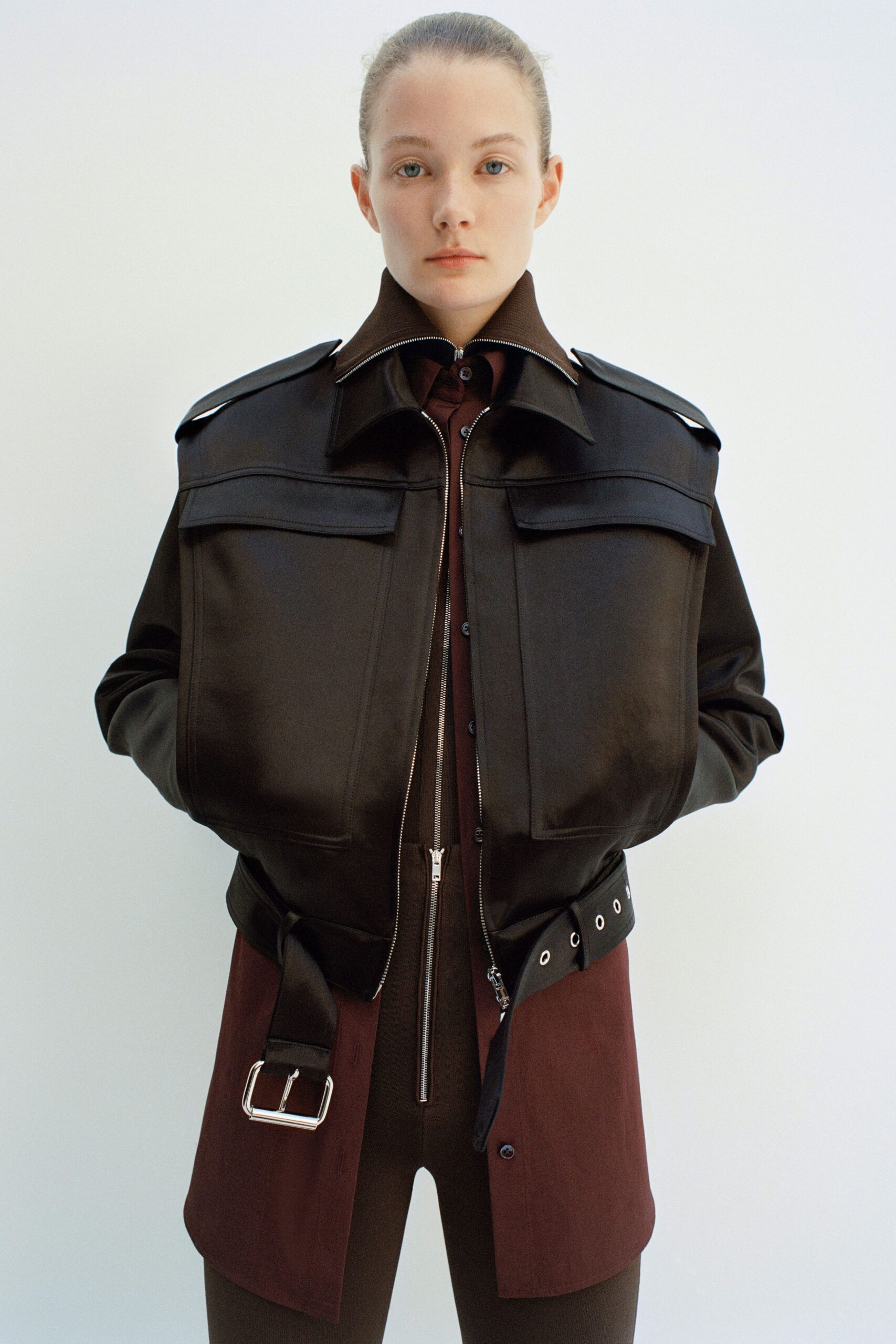 black leather long-sleeve collared fitted zippered buttoned jacket