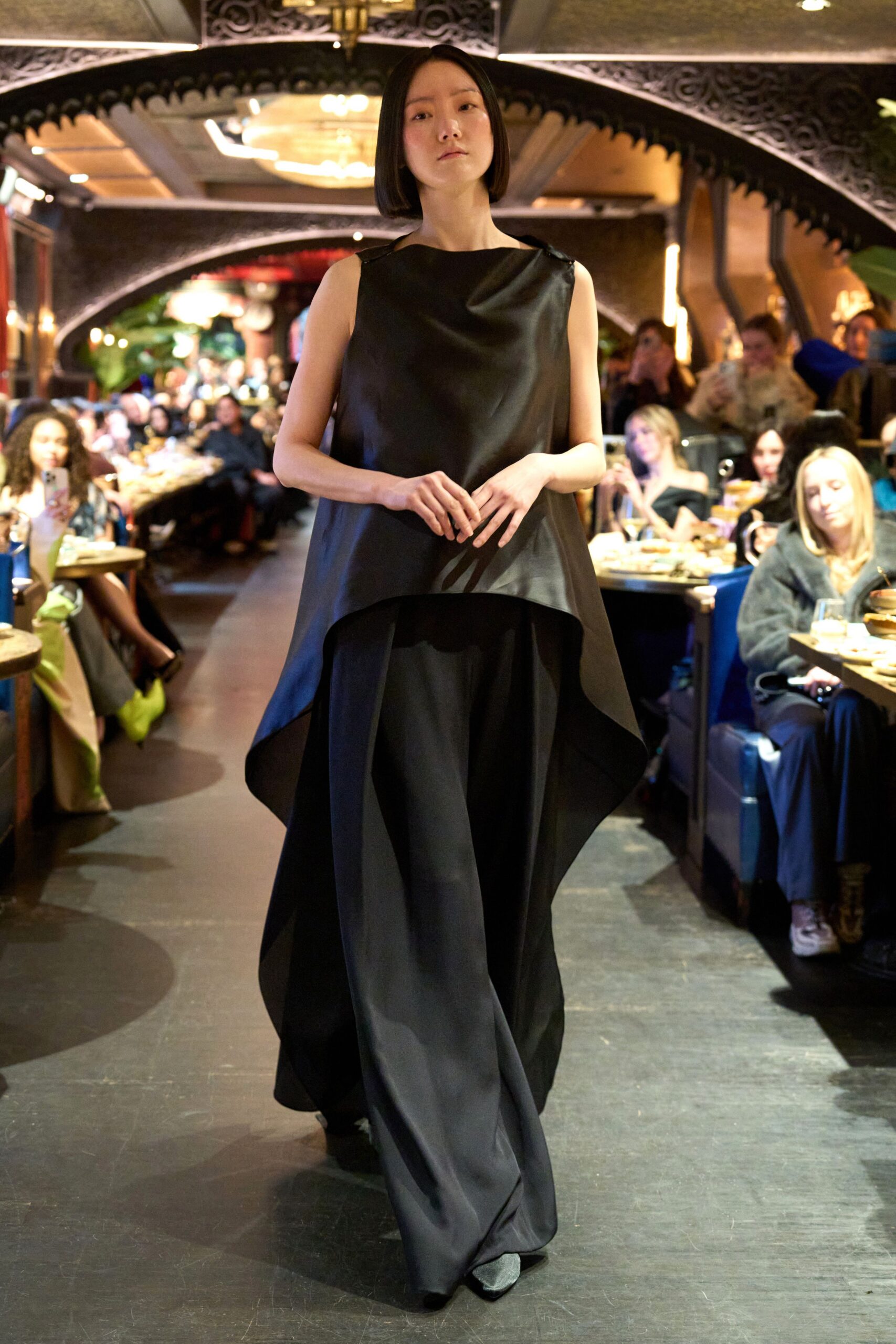 black silk sleeveless high-neck relaxed top