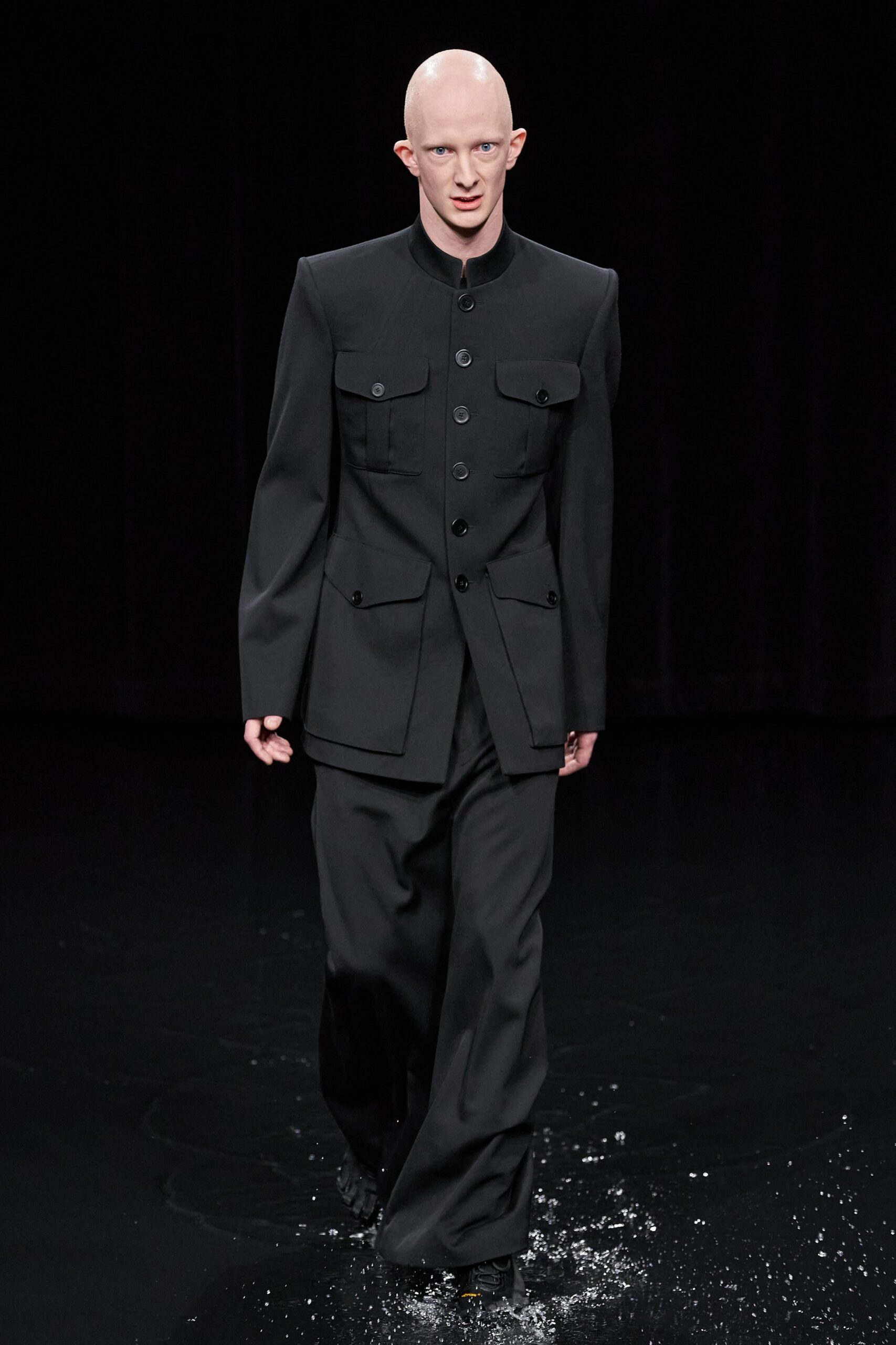 black wool long-sleeve collared tailored buttoned pockets suit