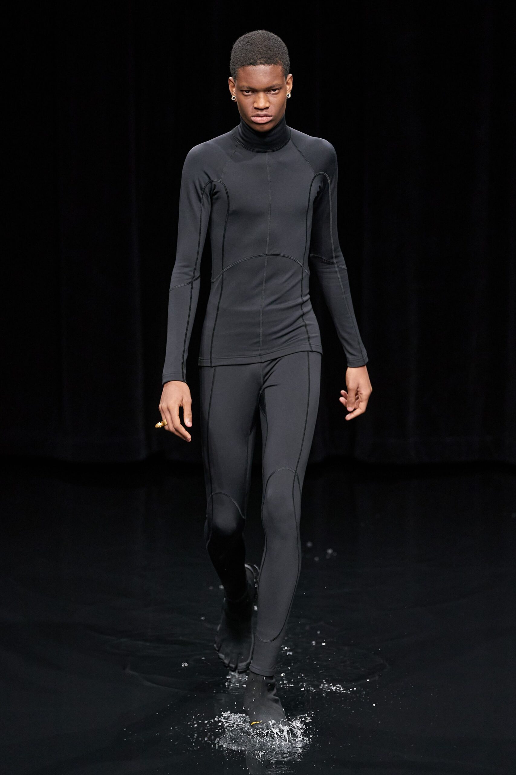 black neoprene long-sleeve turtleneck fitted catsuit