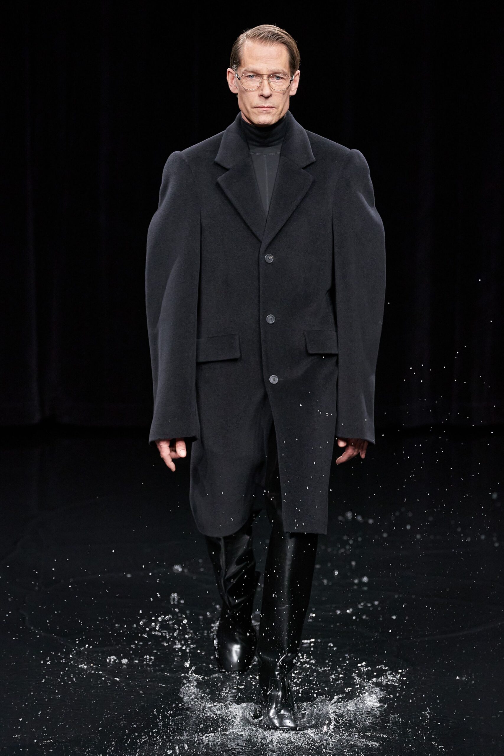 black wool long-sleeve collared structured buttoned coat