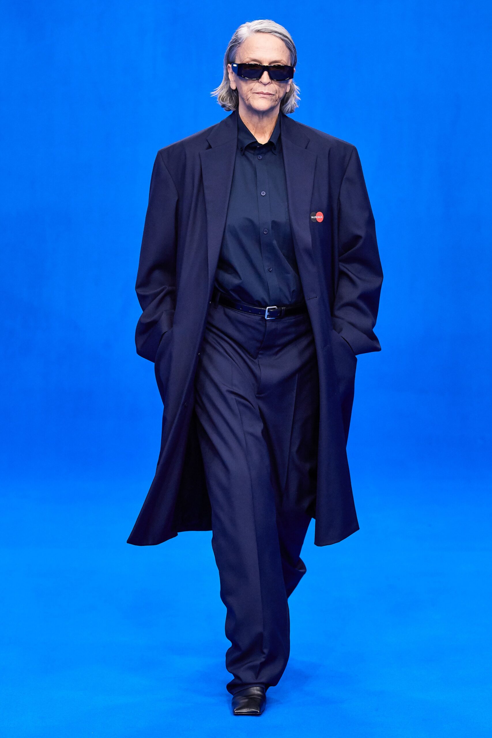 black coat and tailored pants