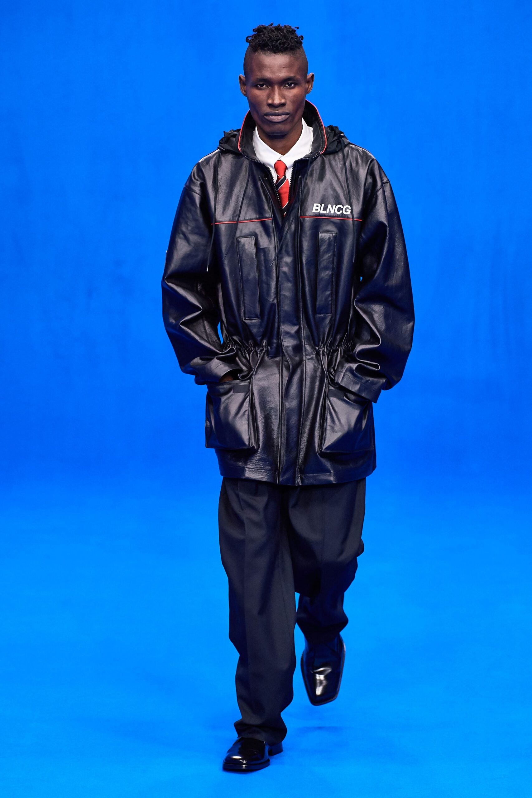 black leather jacket with tailored pants
