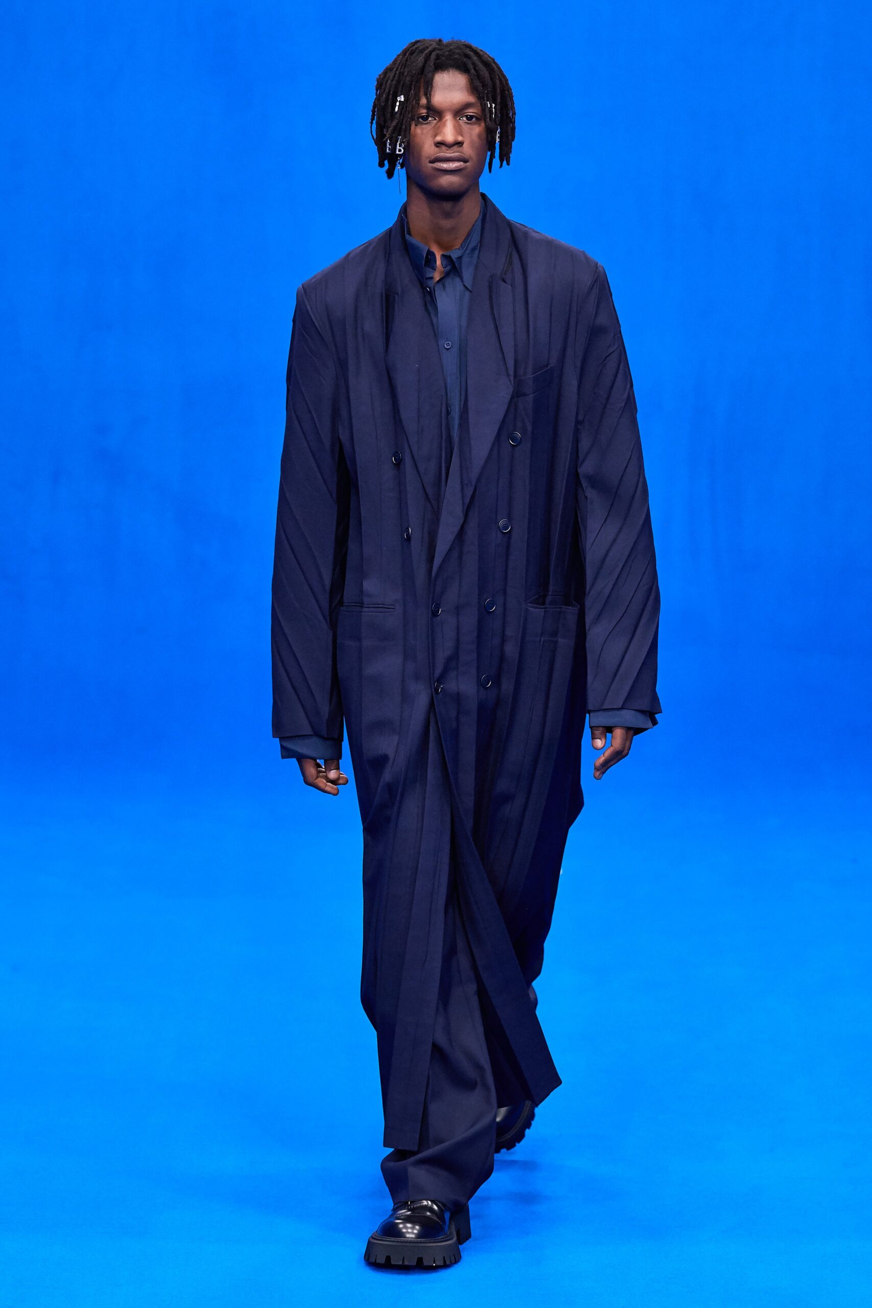 blue oversized coat with relaxed shirt and pants