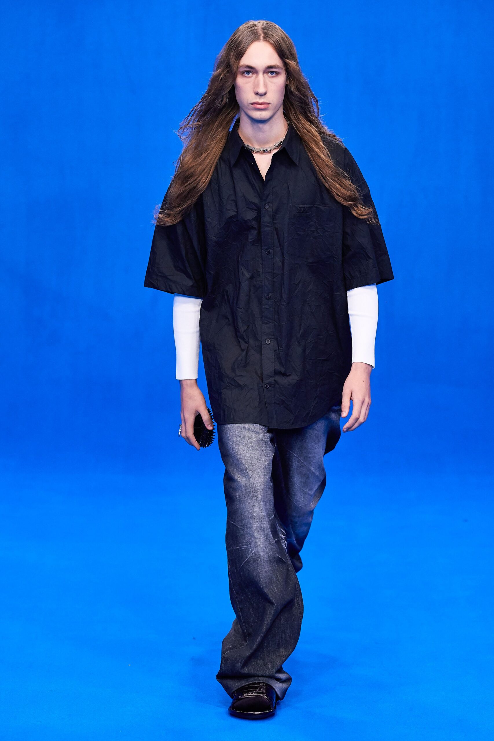 black shirt blue denim pants