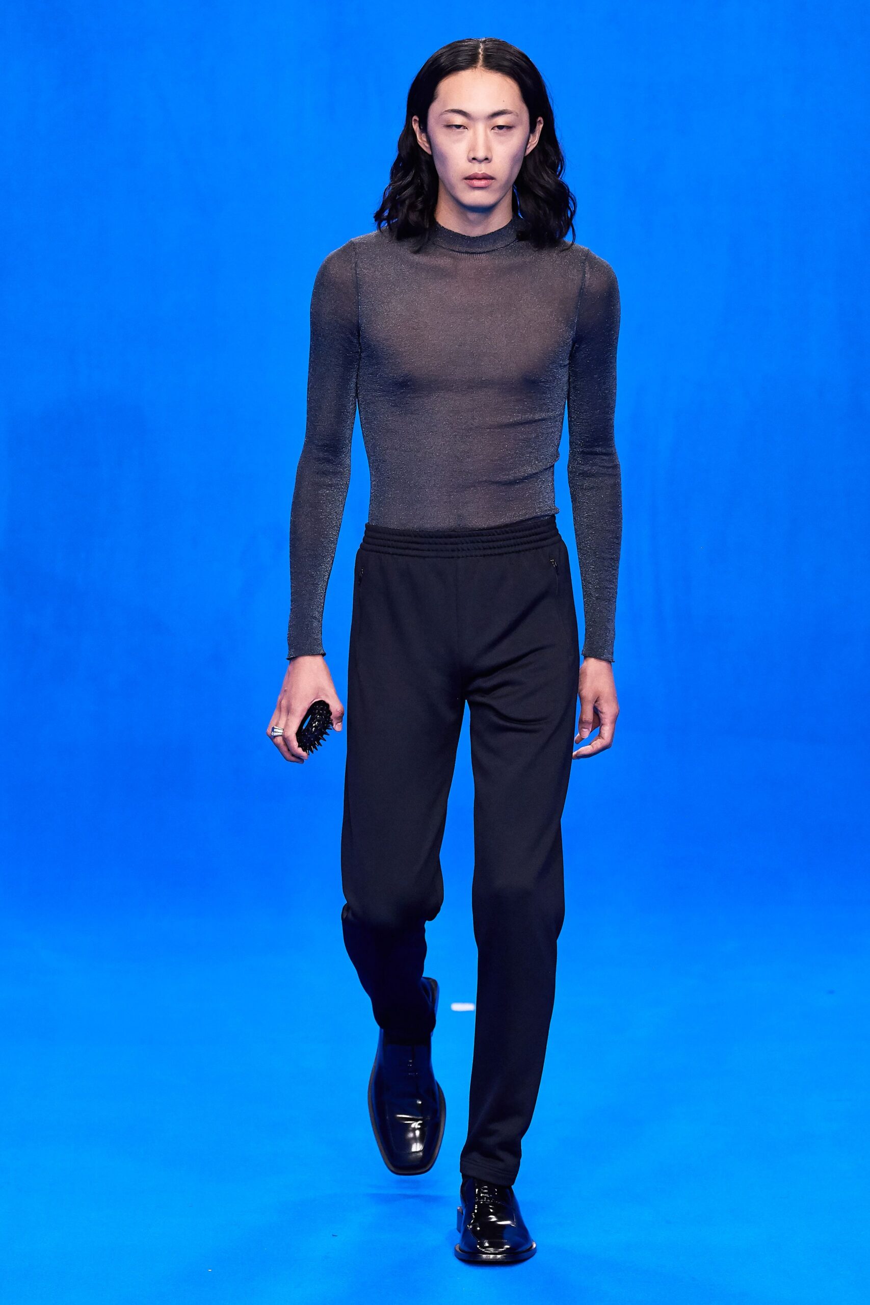 black fitted mesh top with relaxed pants