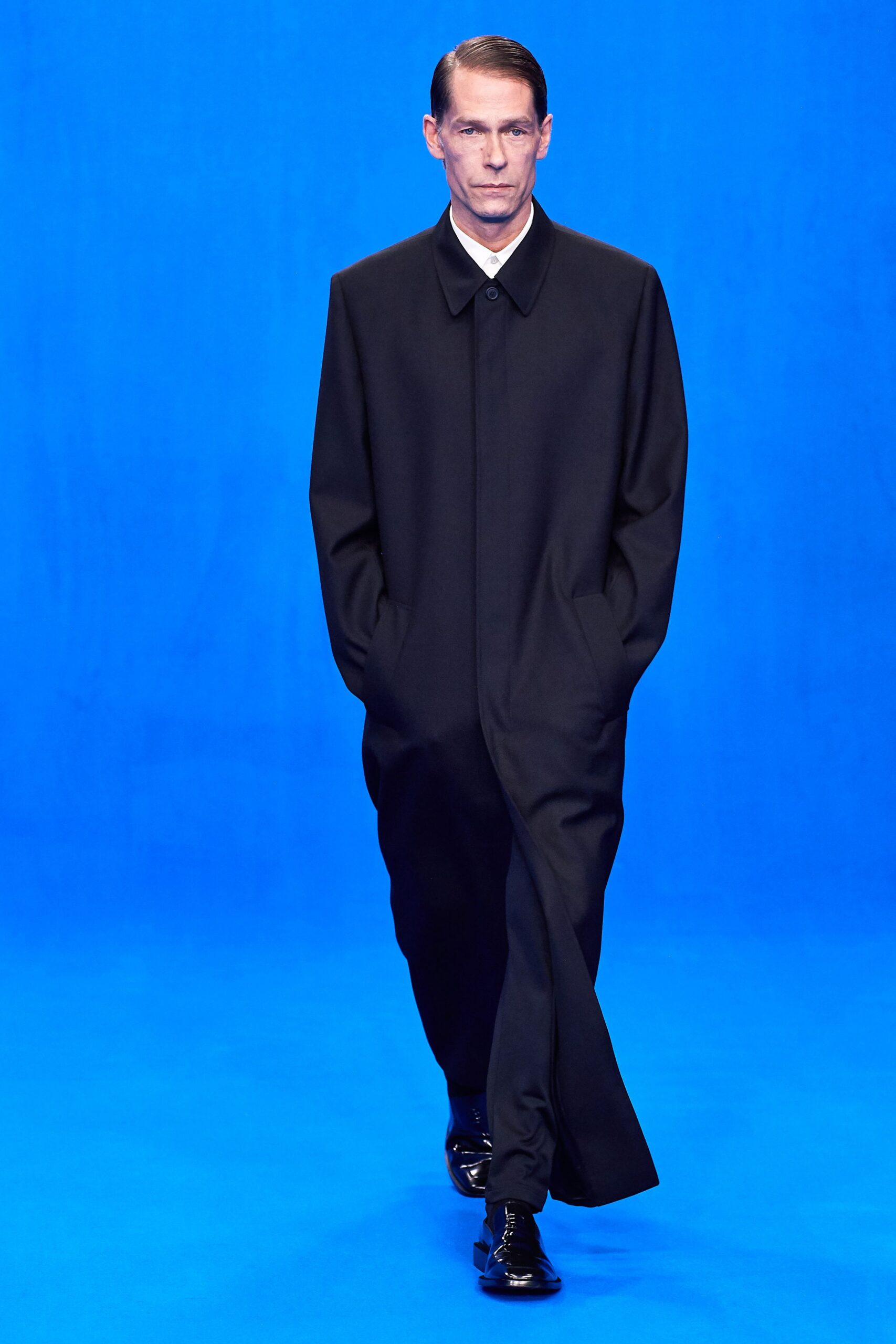 black wool relaxed coat with shoes