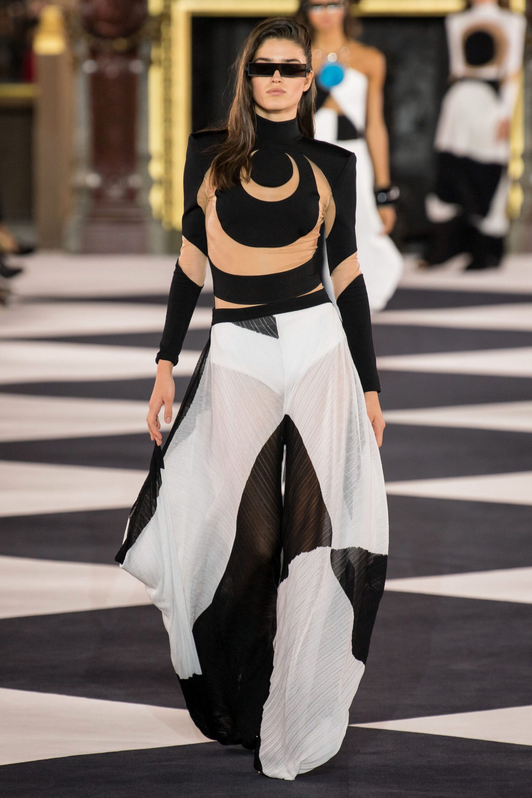 black and tan color-blocked top with flared pants