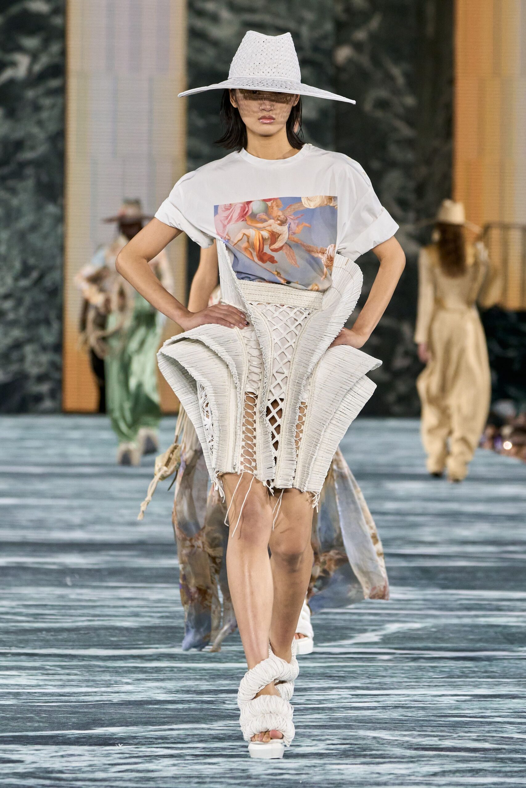 white t-shirt with pleated skirt