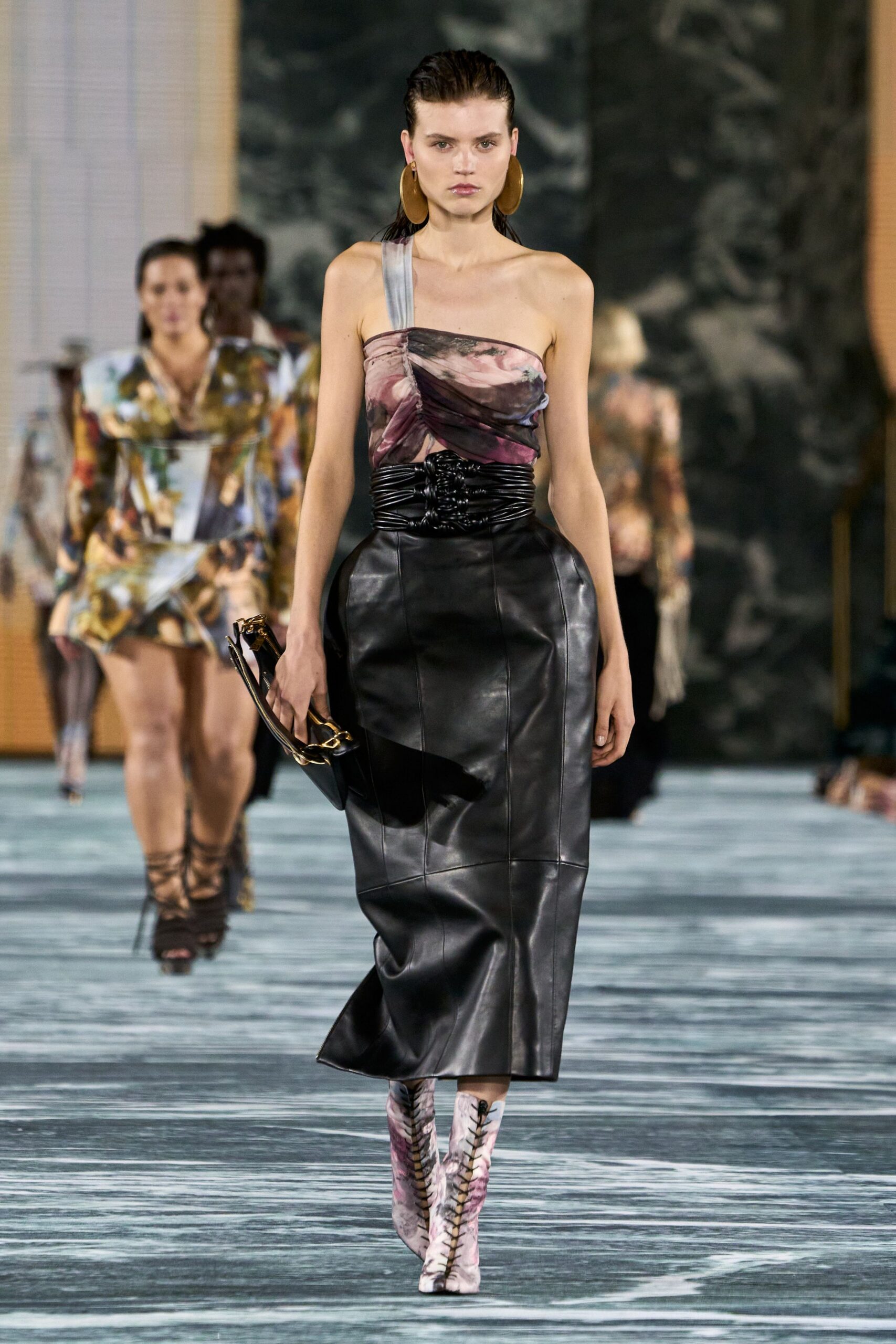 fitted pink silk top with black leather skirt