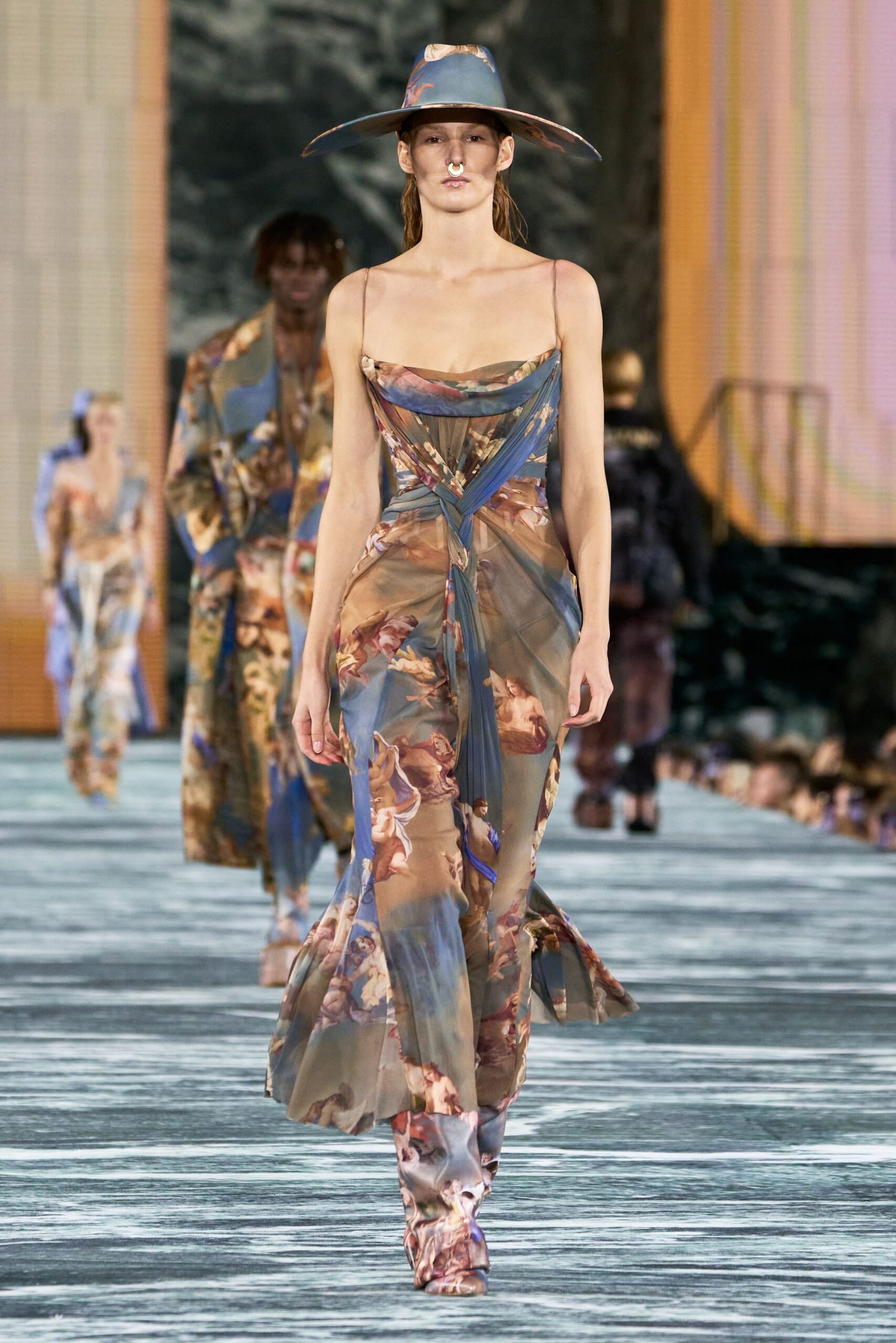 blue silk sleeveless v-neck fitted draped flared gown