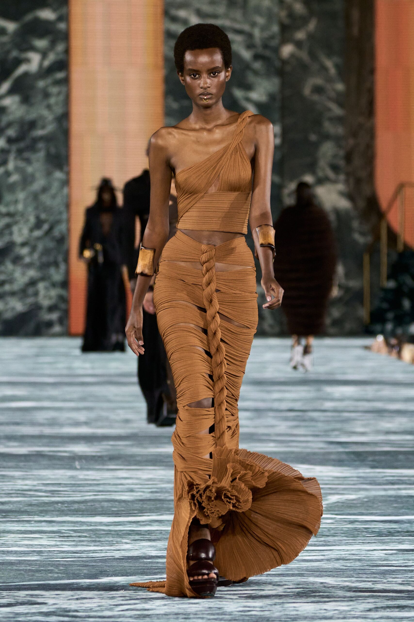 brown silk sleeveless high-neck fitted pleated tiered gown