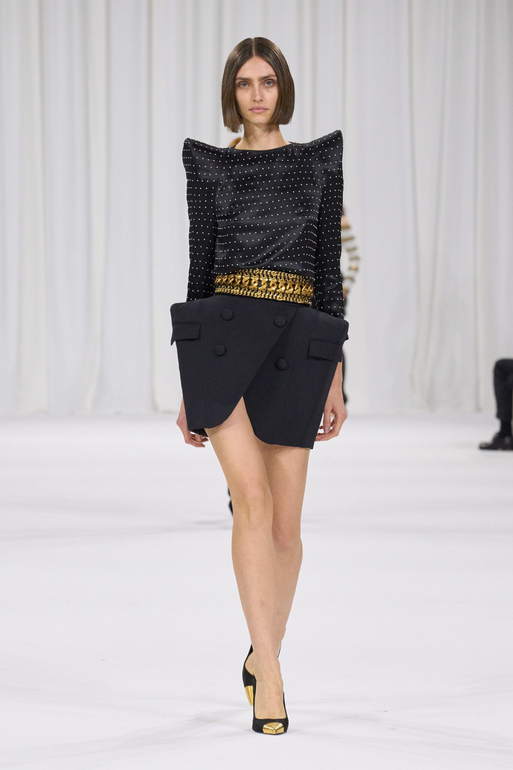black embellished top with mini skirt
