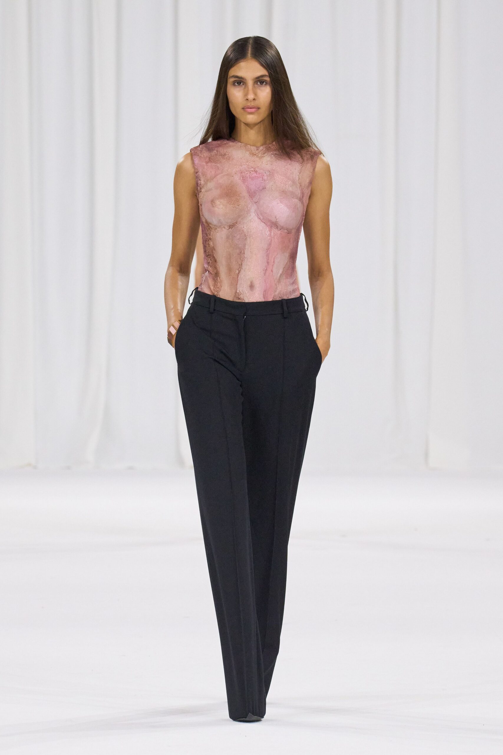 pink silk fitted top with black tailored pants