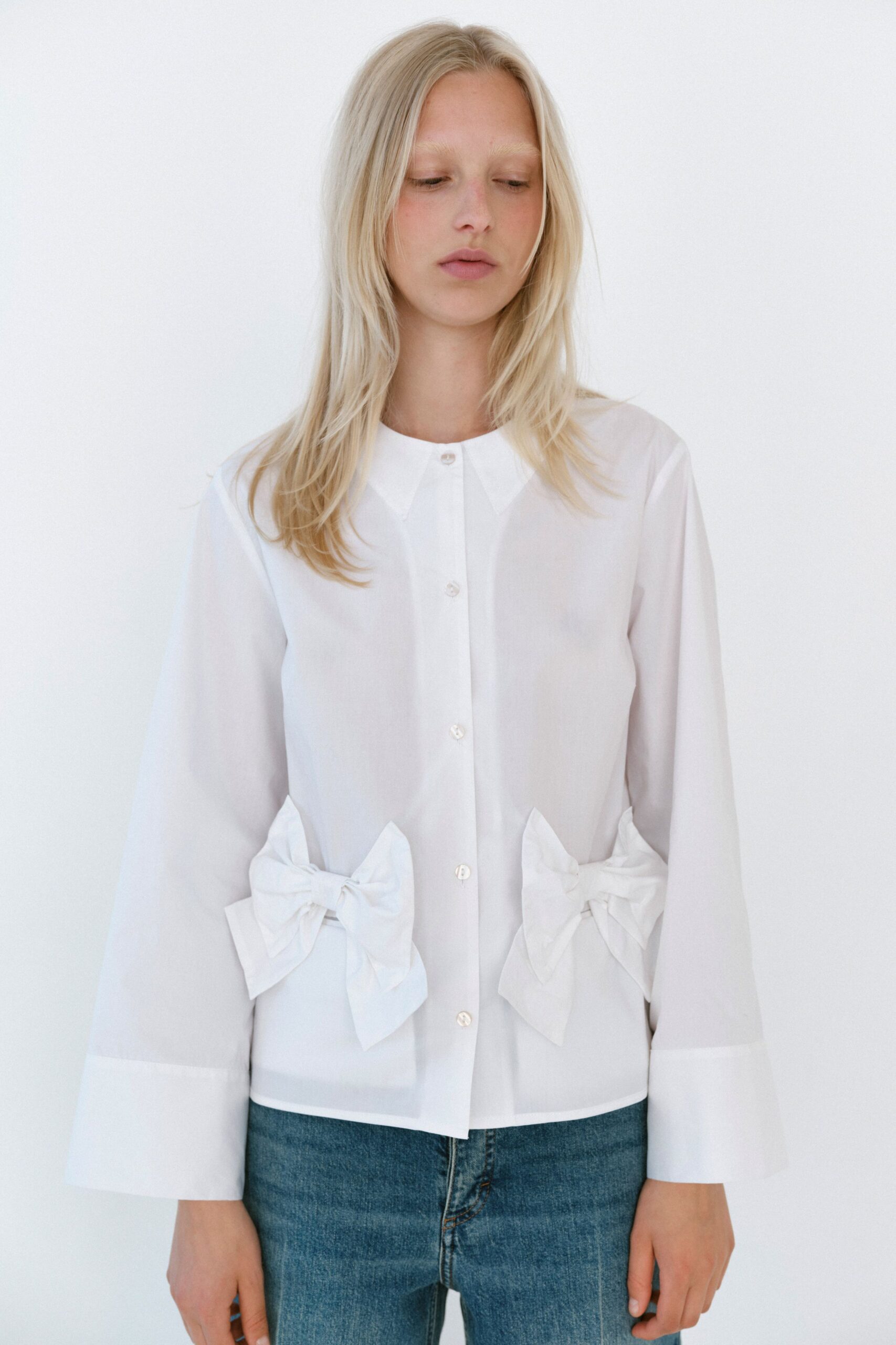 white cotton long-sleeve collared relaxed buttoned pleated shirt