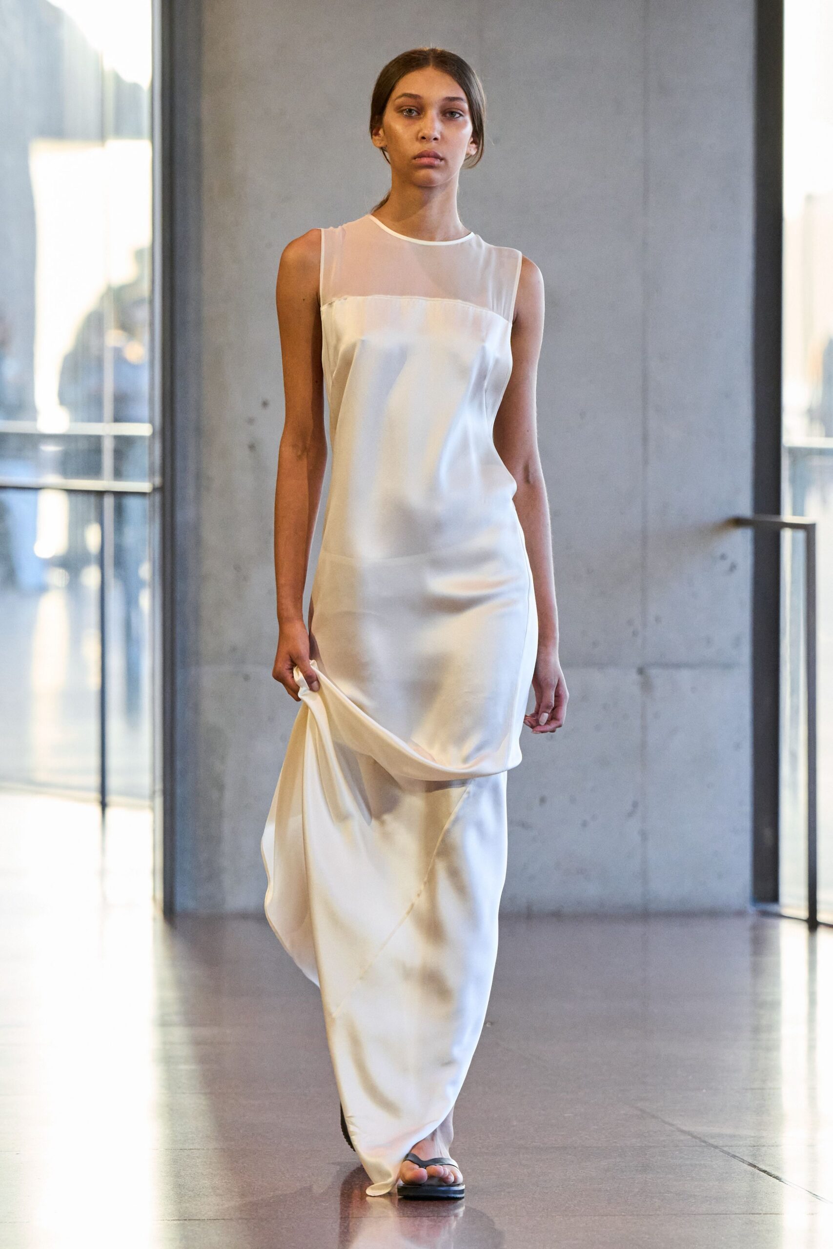white silk sleeveless high-neck fitted draped flowing gown