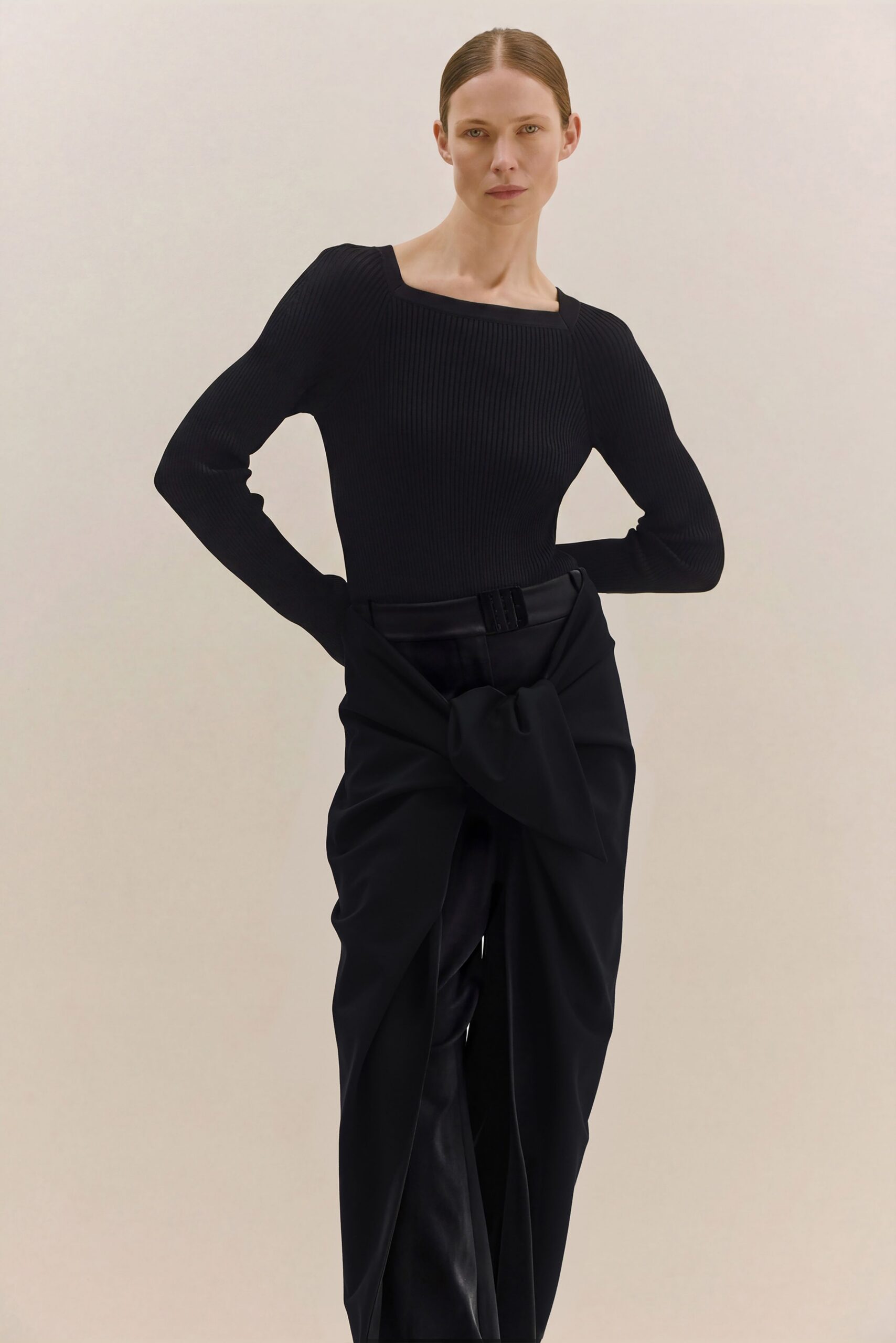 black fitted top and relaxed pants