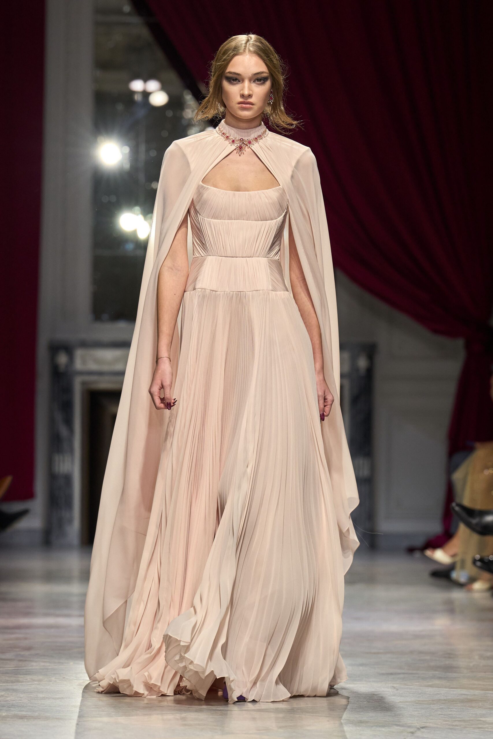 beige silk sleeveless v-neck fitted pleated draped gown