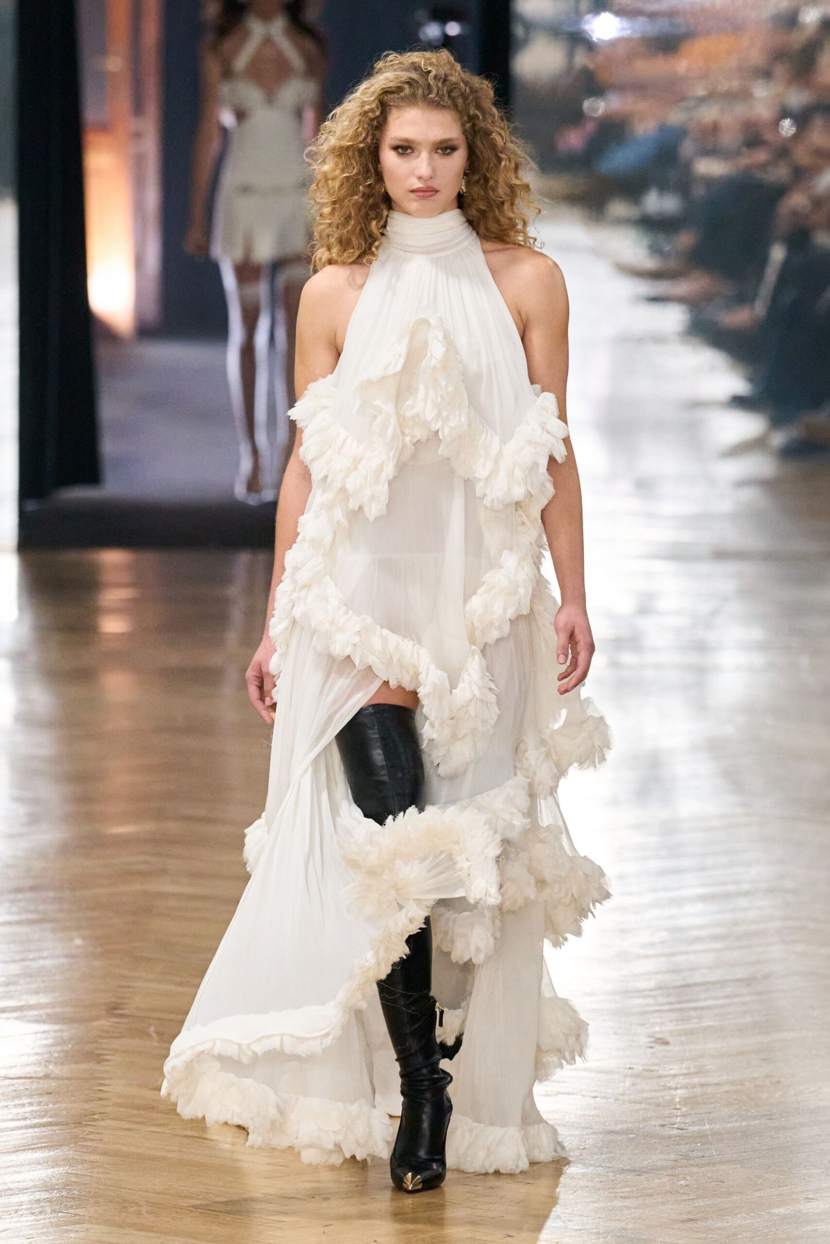 white chiffon sleeveless high-neck fitted ruffled layered gown