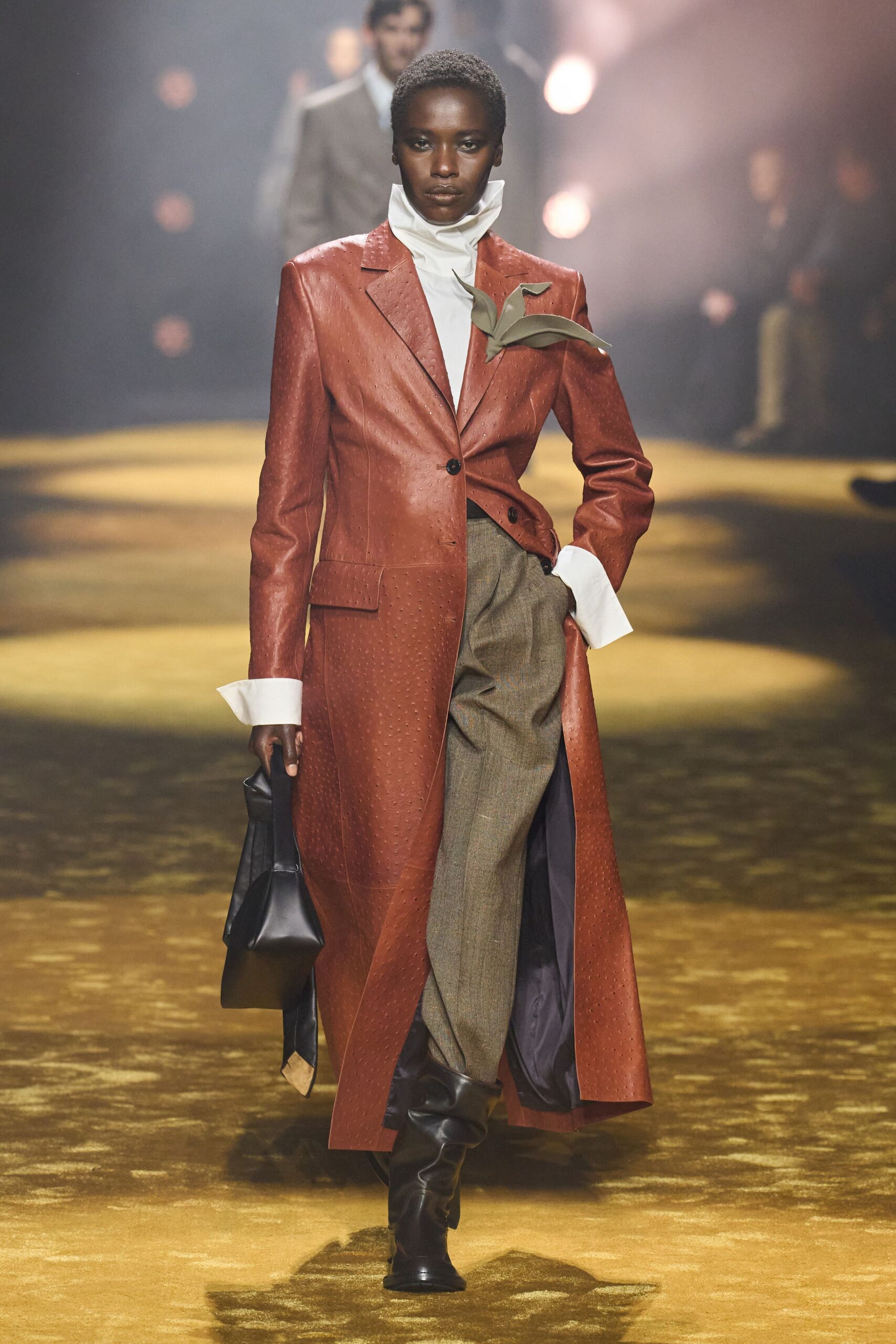 brown leather coat with gray pants