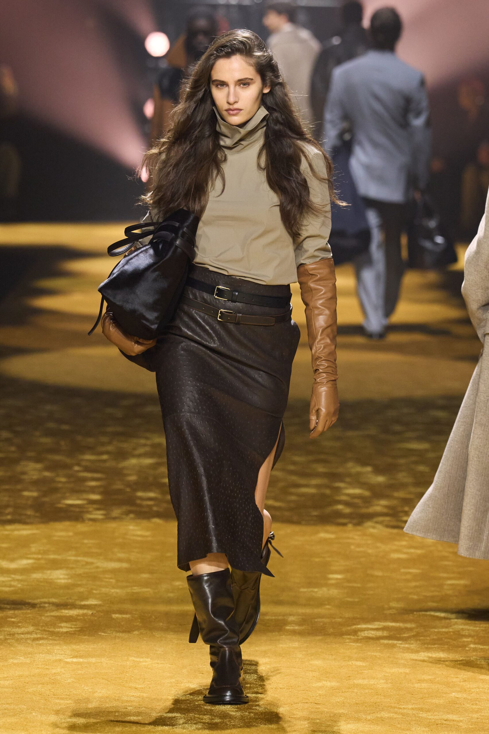 beige fitted top and black midi skirt
