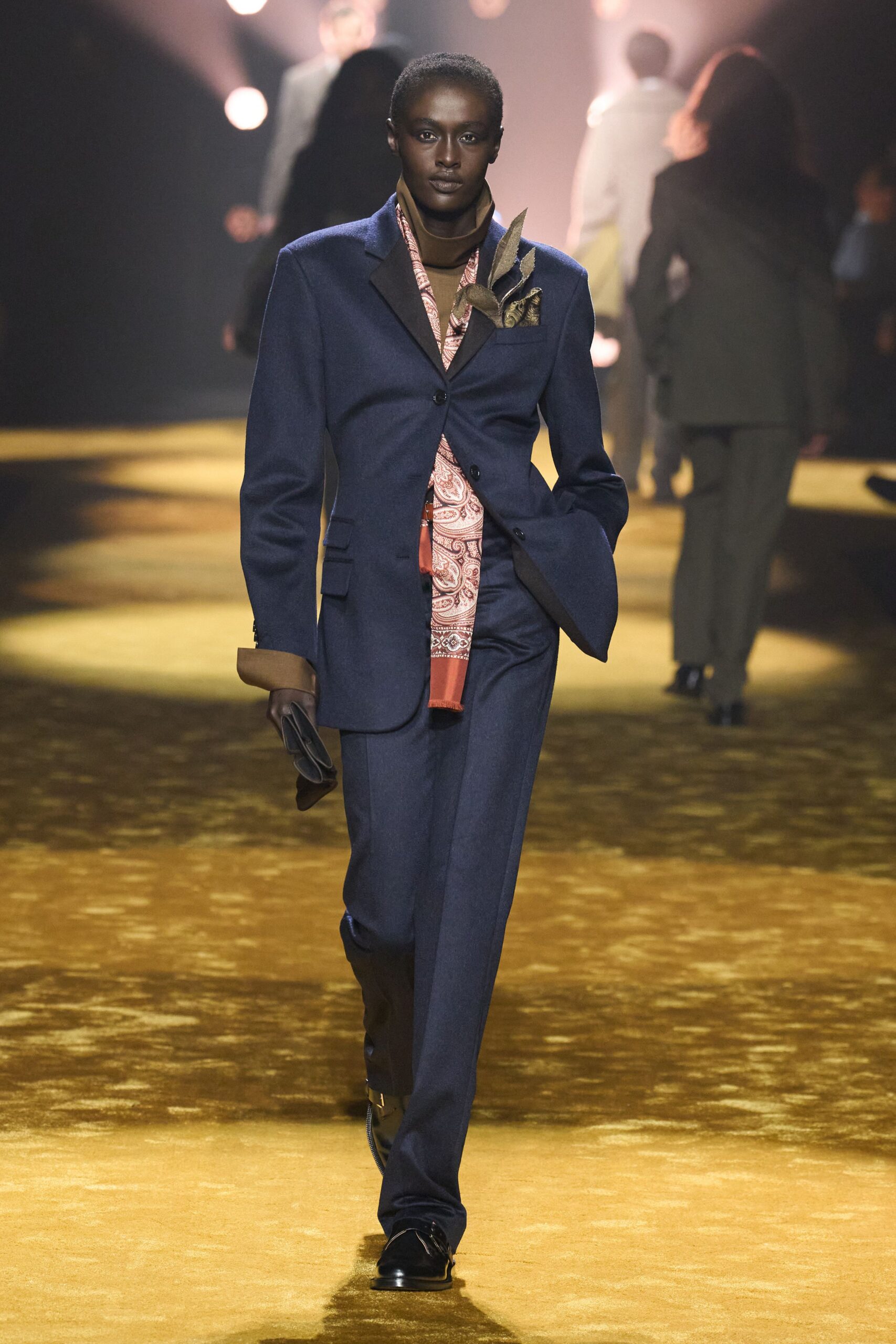 blue tailored suit with orange shirt
