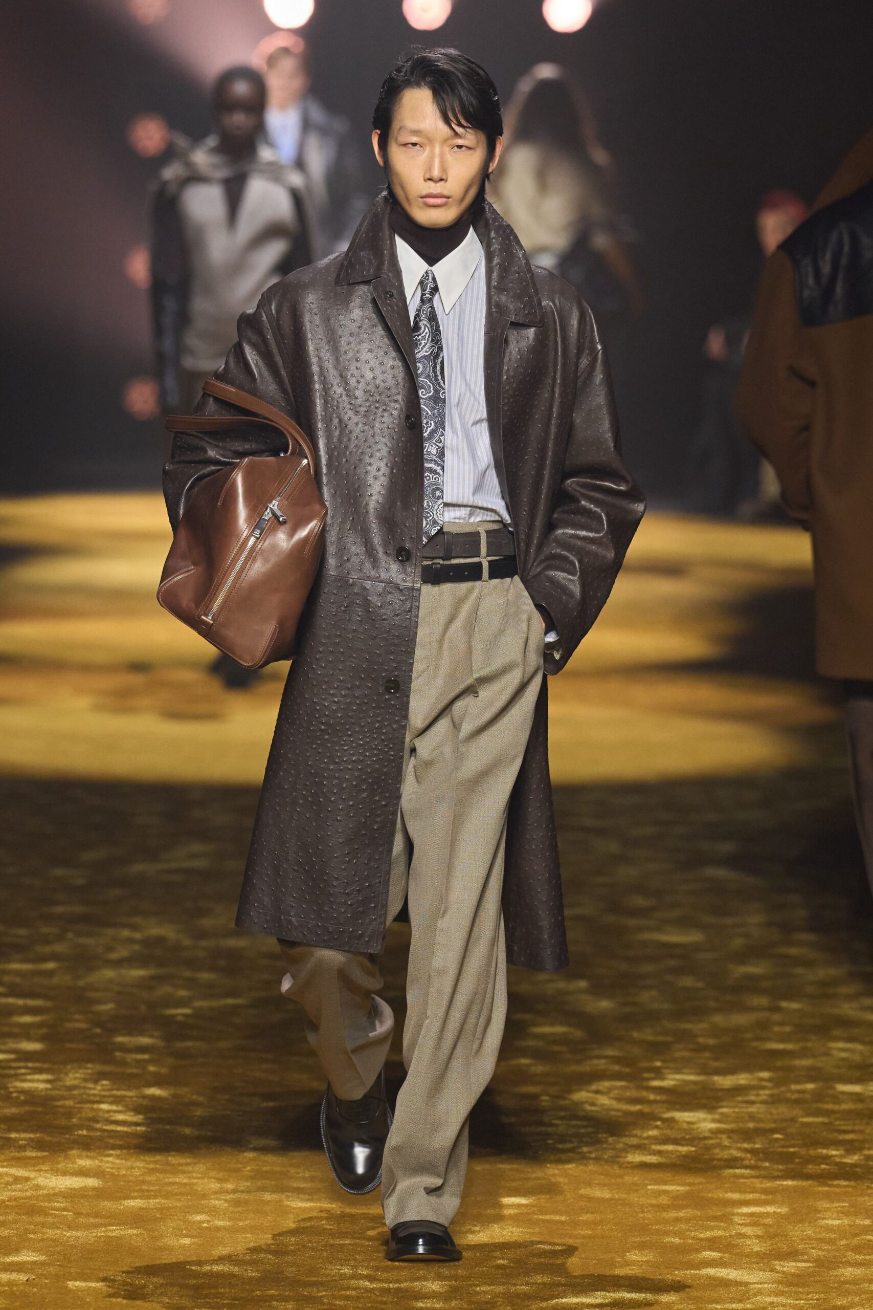 brown leather coat with gray pants