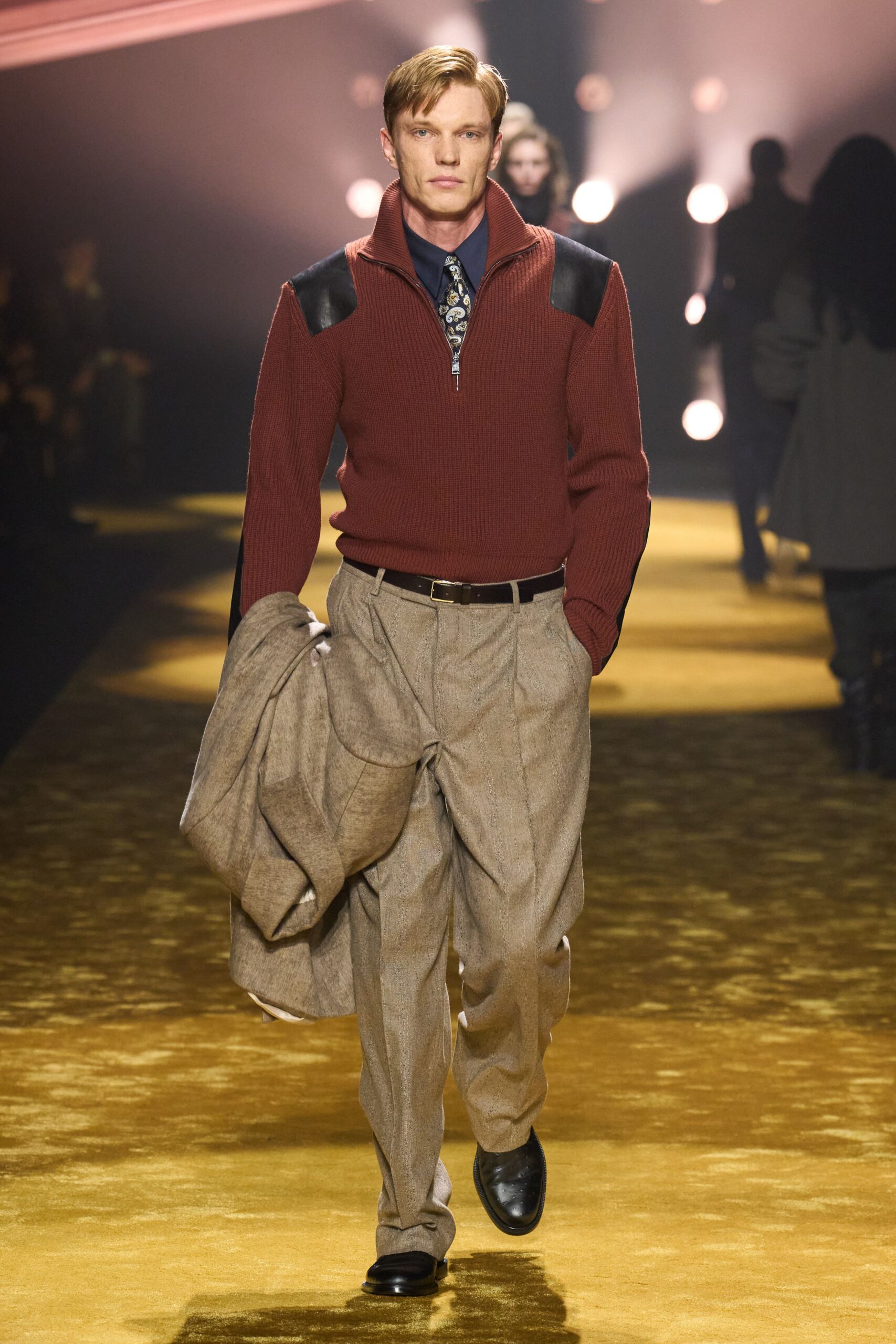 red wool sweater with beige pants