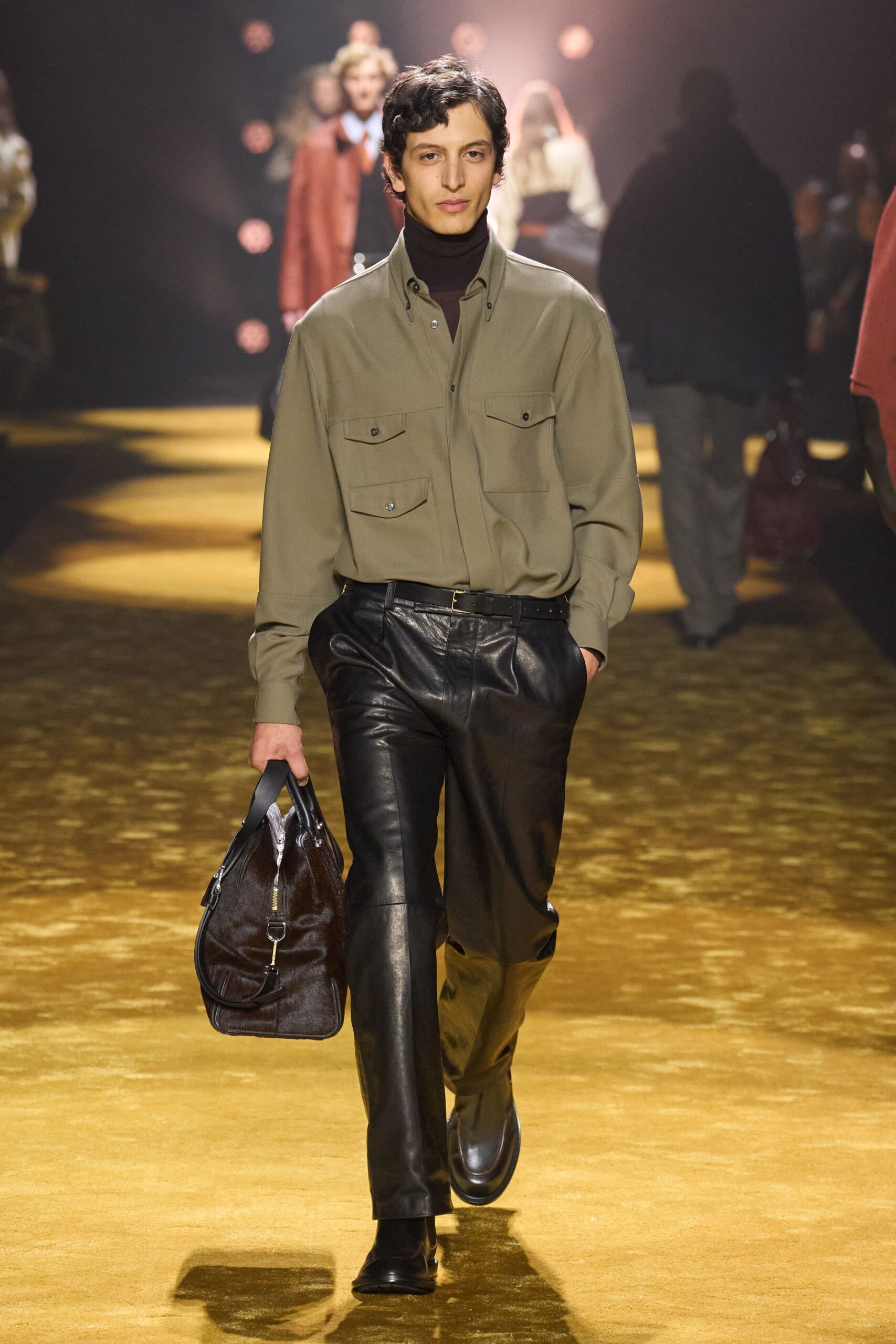 green shirt black leather pants