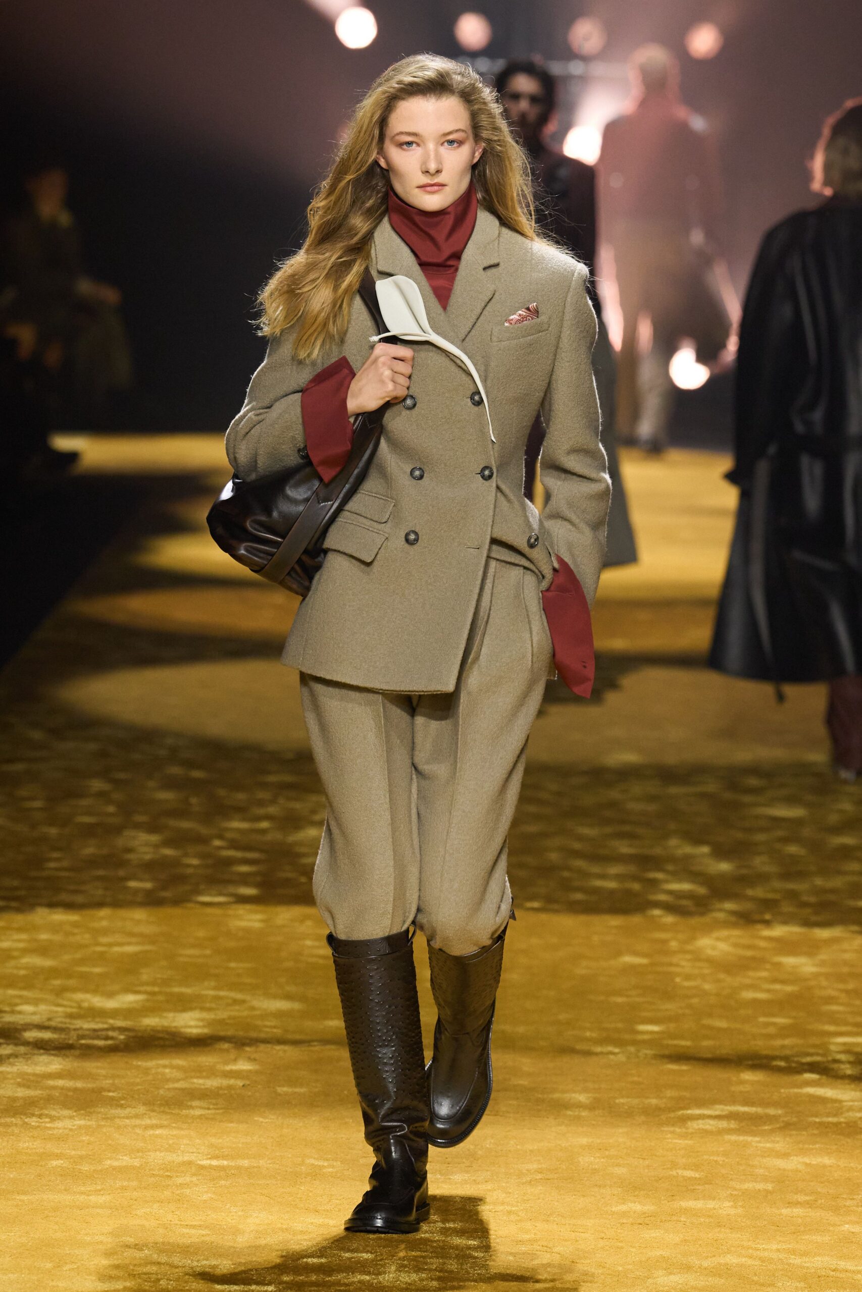 beige tailored suit with red top