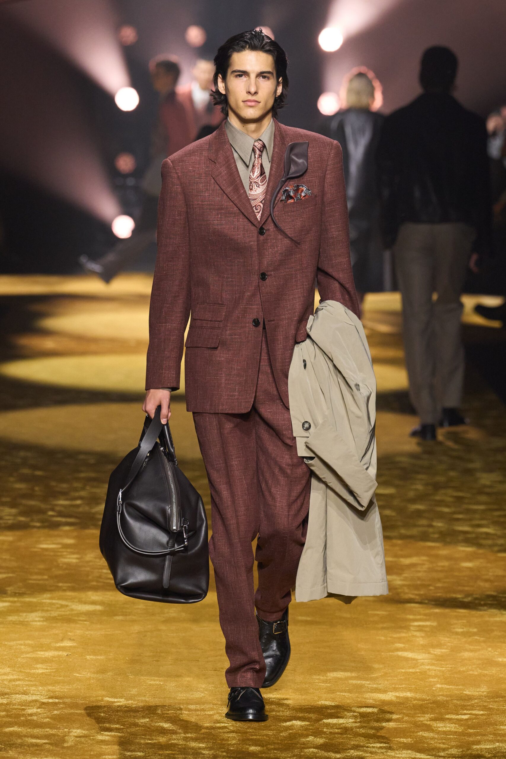 maroon tailored suit with beige coat