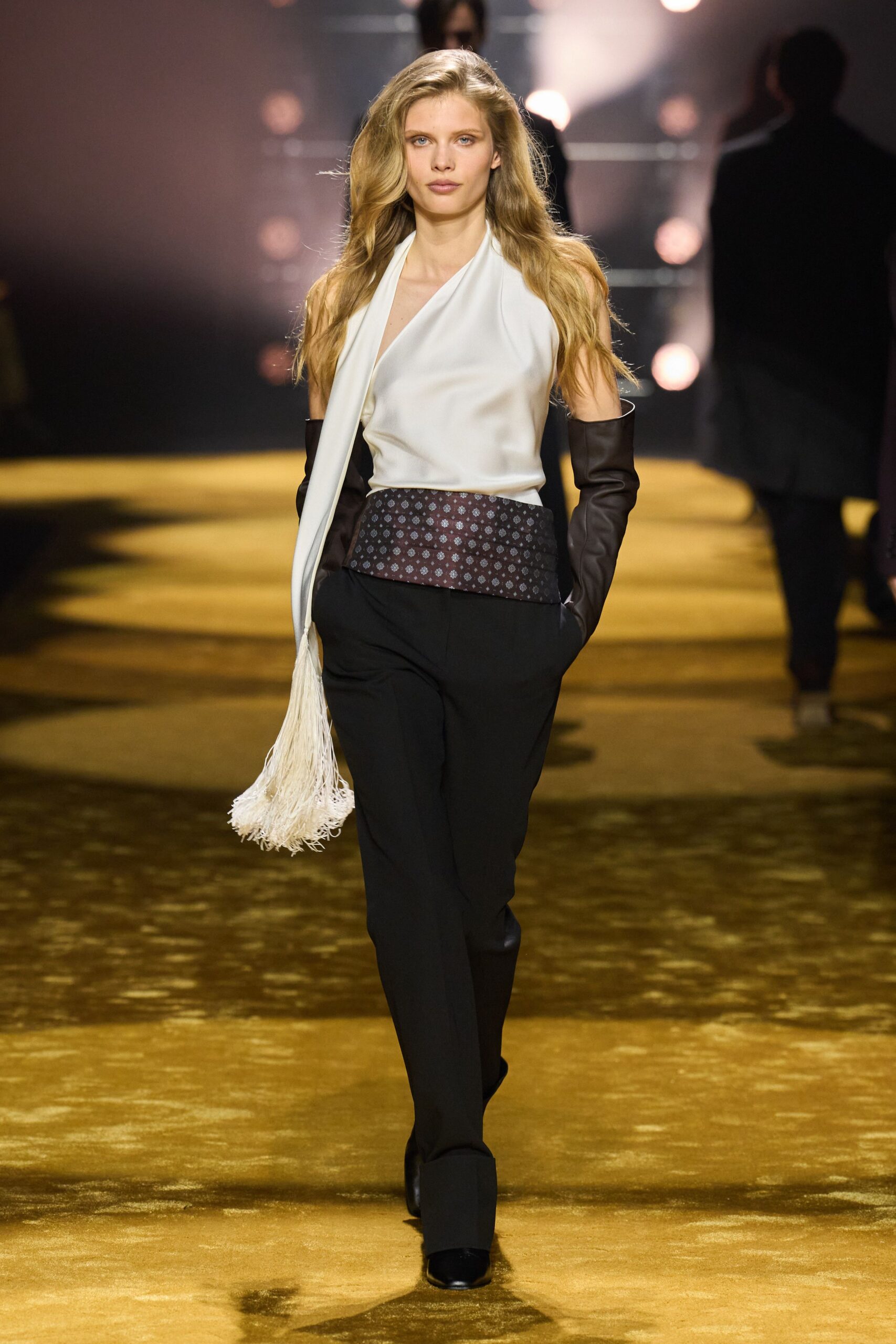 white silk sleeveless top with black tailored pants