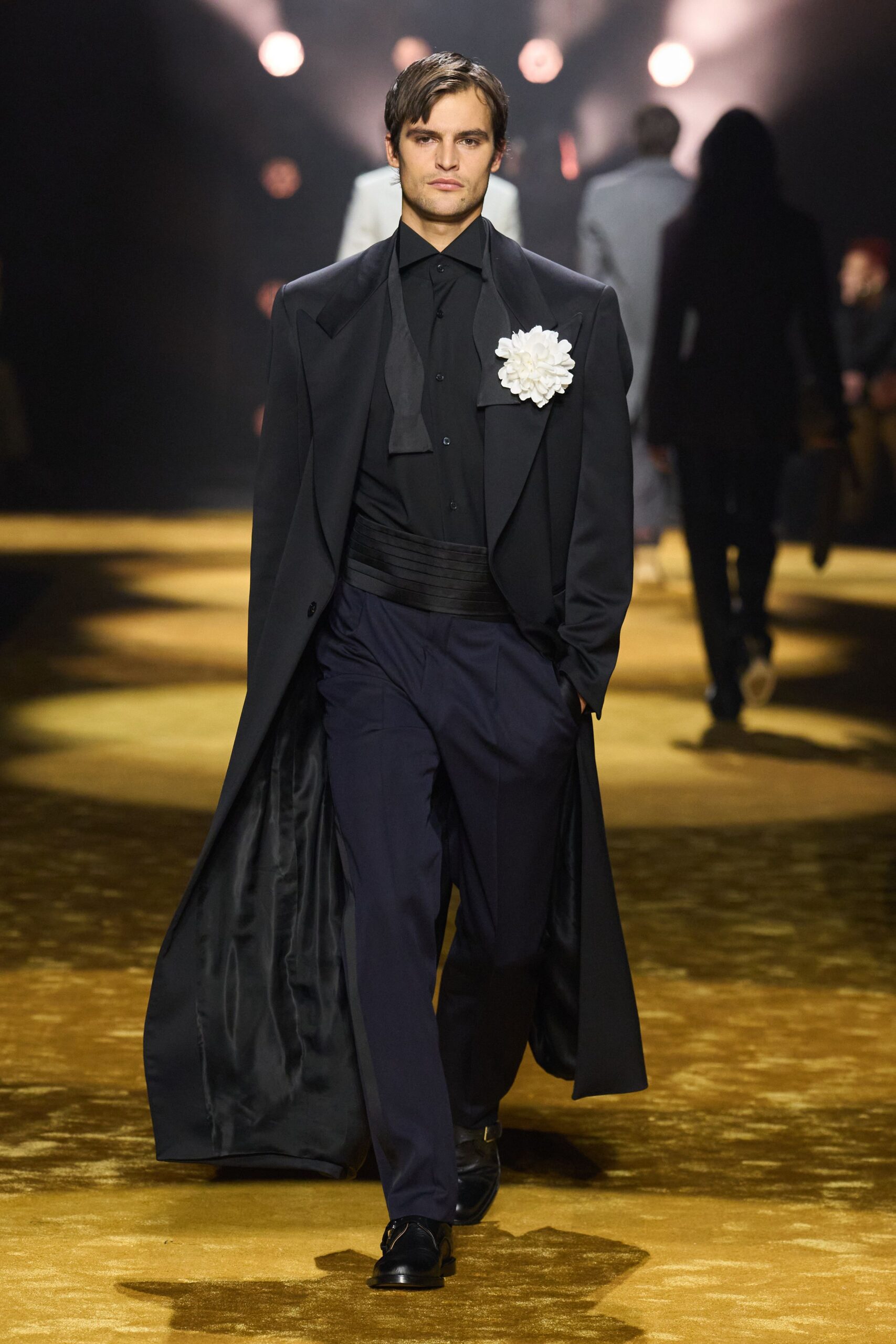 black coat with white flower accessory
